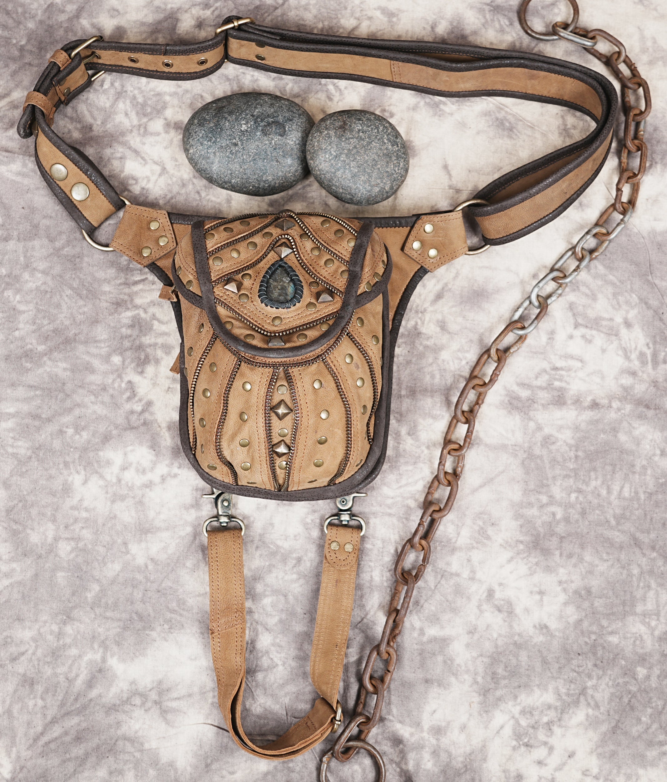 Built-in loops/tabs for attaching pouches or decorative charms.