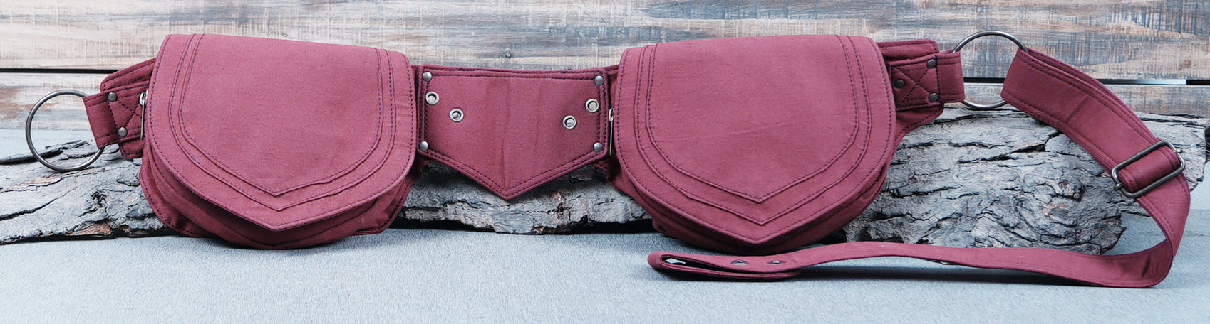 Robust canvas fanny pack with unique shield-shaped pockets, great for events.
