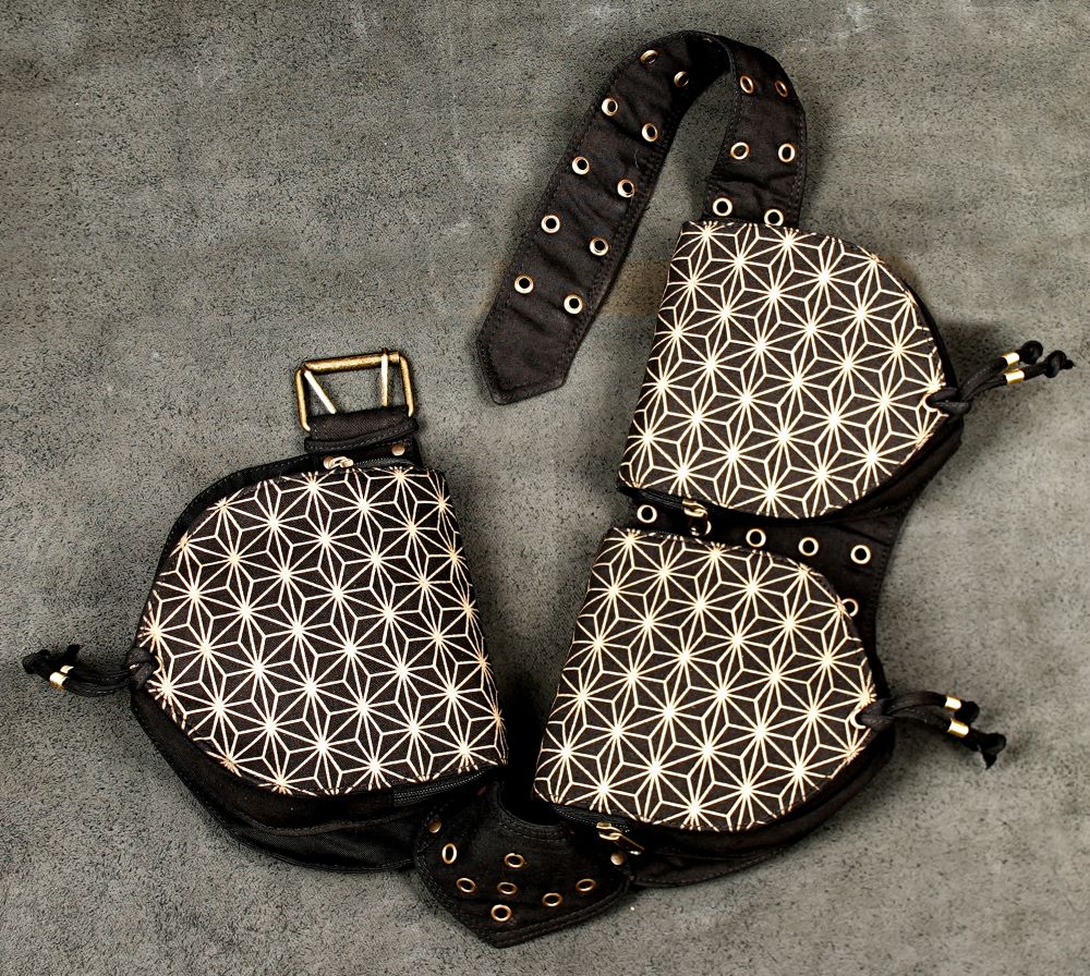 Gothic cotton waist belt bag with geometric patterned pockets, adjustable studded strap, metal eyelets, and multiple compartments
