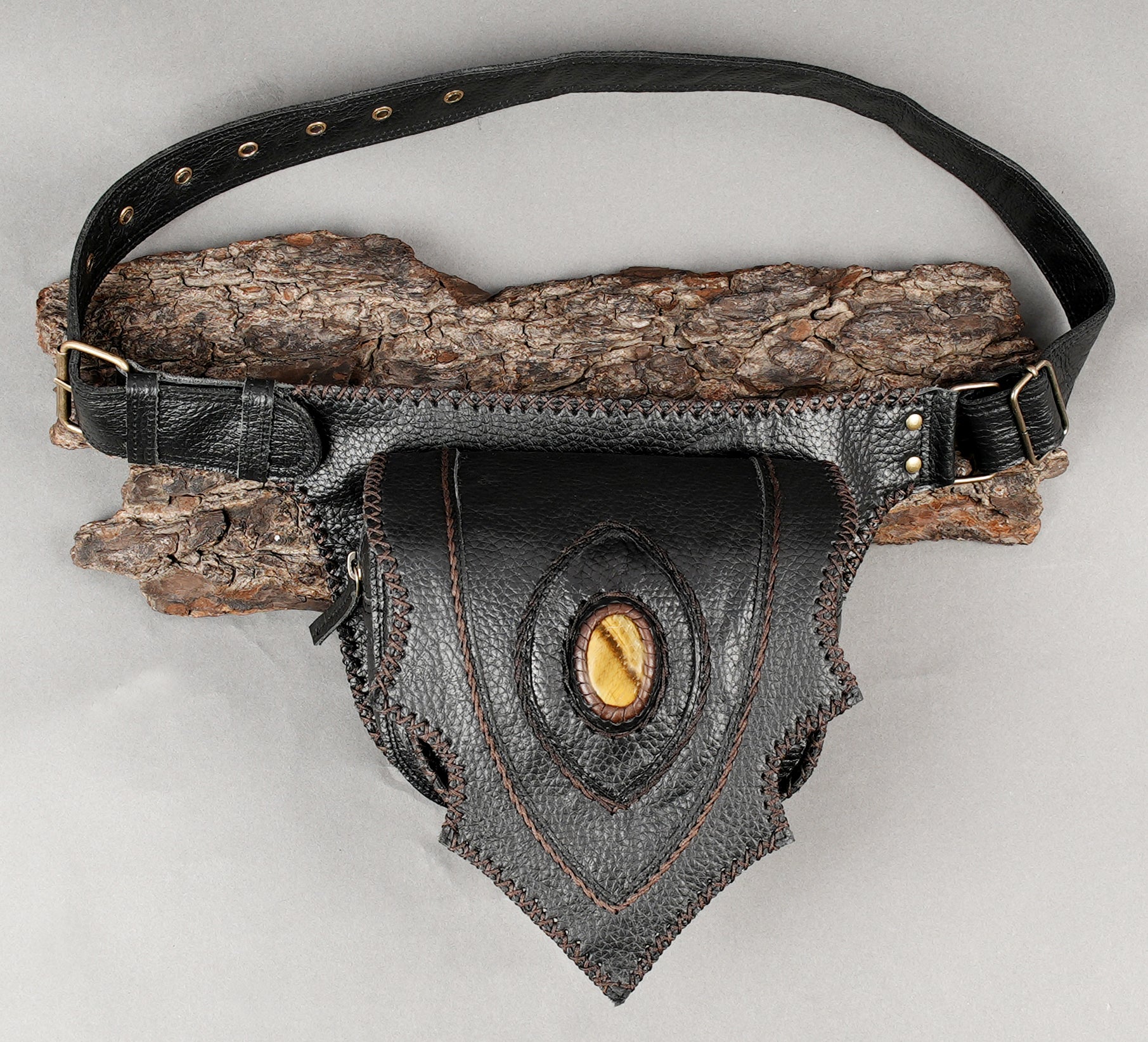 Adjustable black leather waist pouch with tribal-style panel