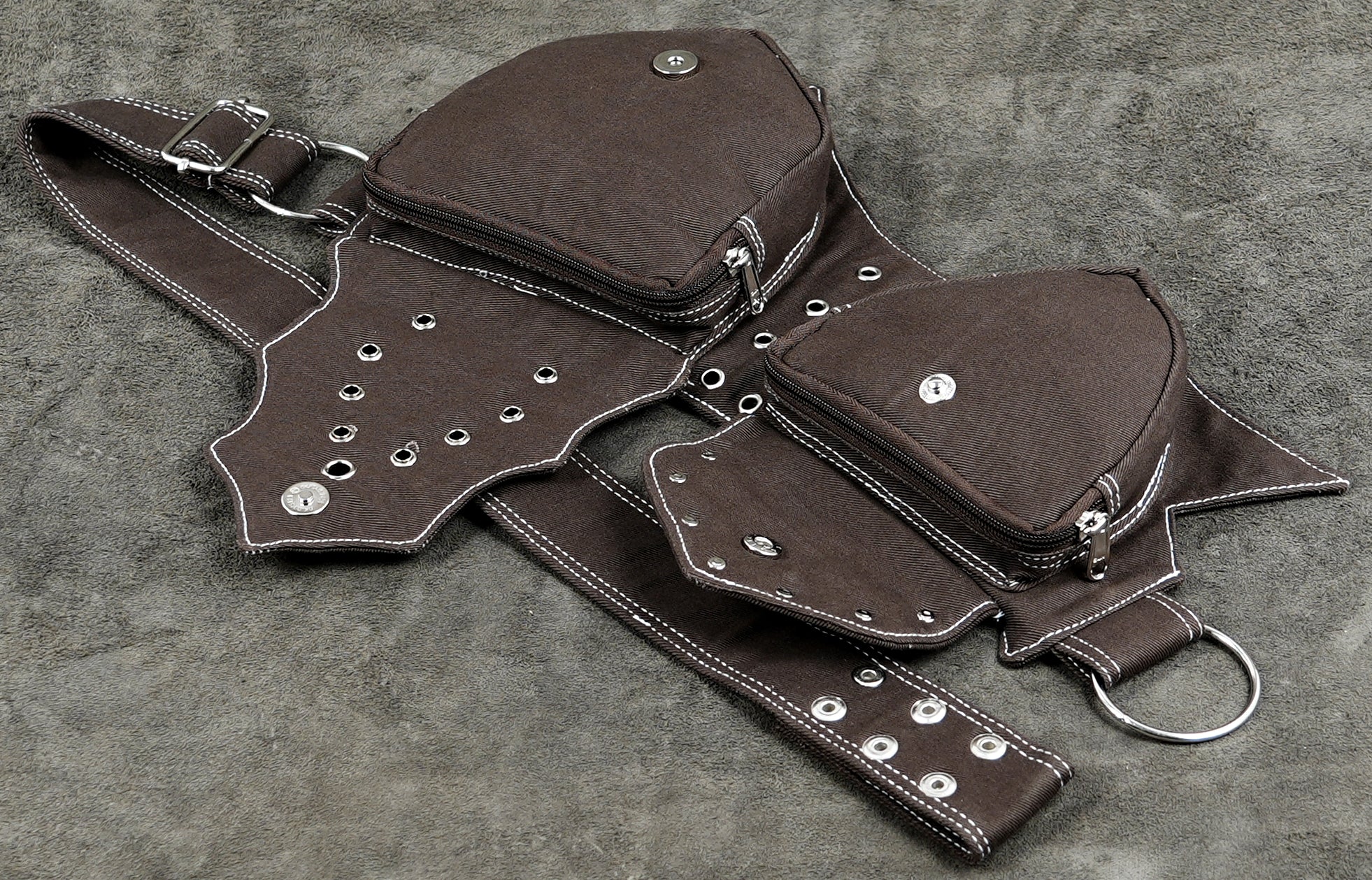 Two-pocket brown cotton waist belt with zip closures and eyelets