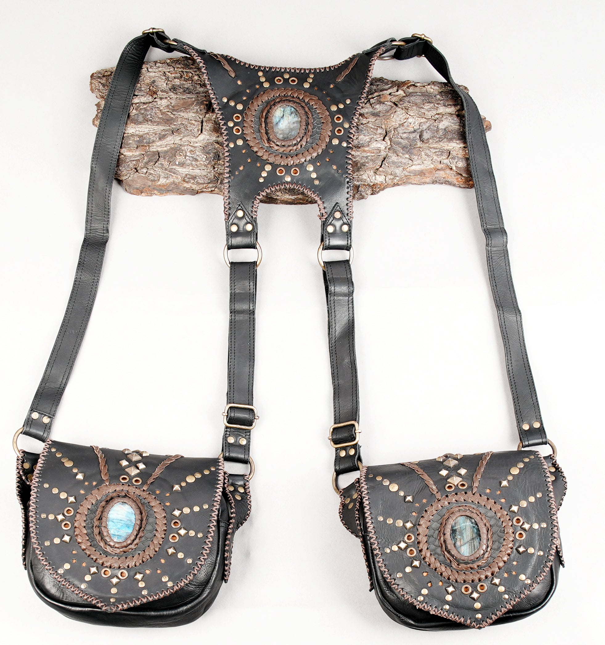 Black leather dual holster harness with gemstone inlay and stud detailing