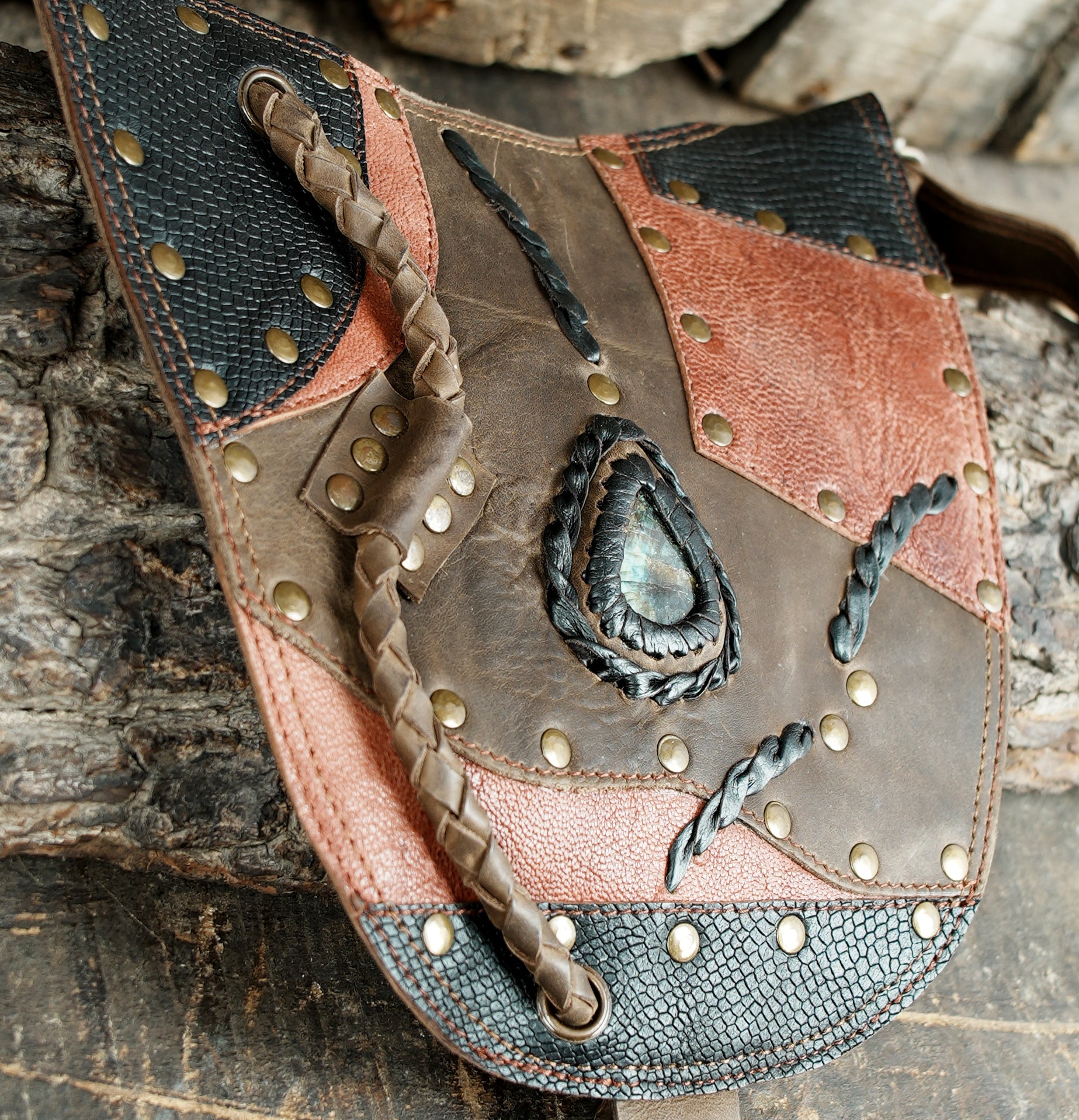 “Handmade patchwork leather holster with dual pouches and gemstone accents”