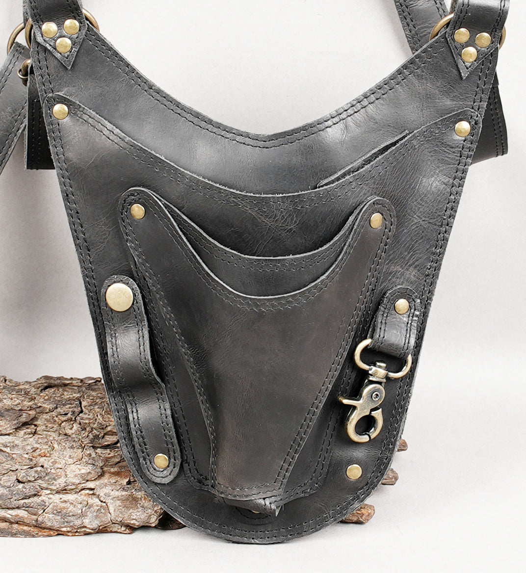 Dual pocket leather holster with metal clip attachments