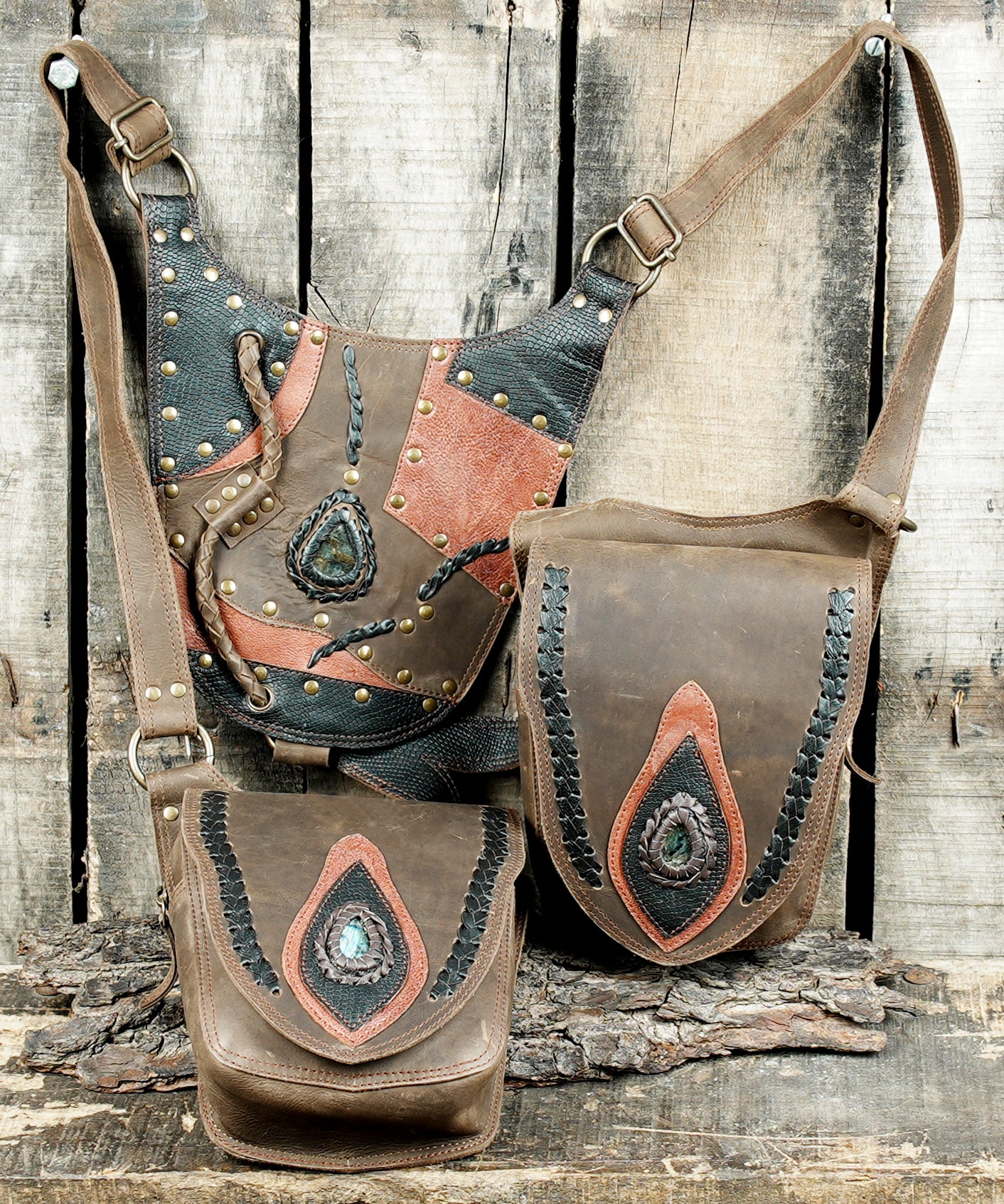 “Hand-stitched leather holster with tribal patchwork patterns and dual pockets”