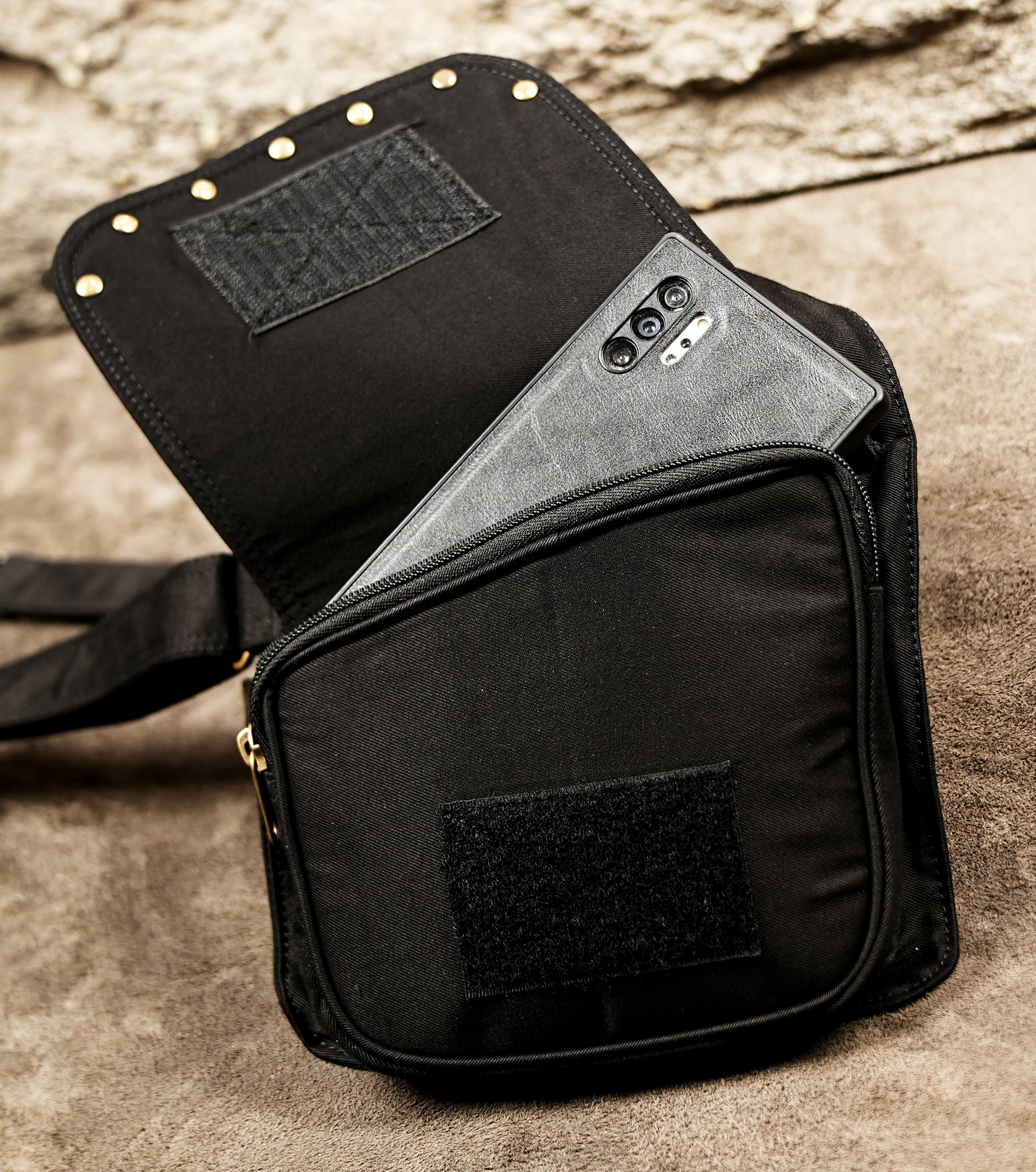 Cotton underarm bag with cross-back straps and gold metal buckles