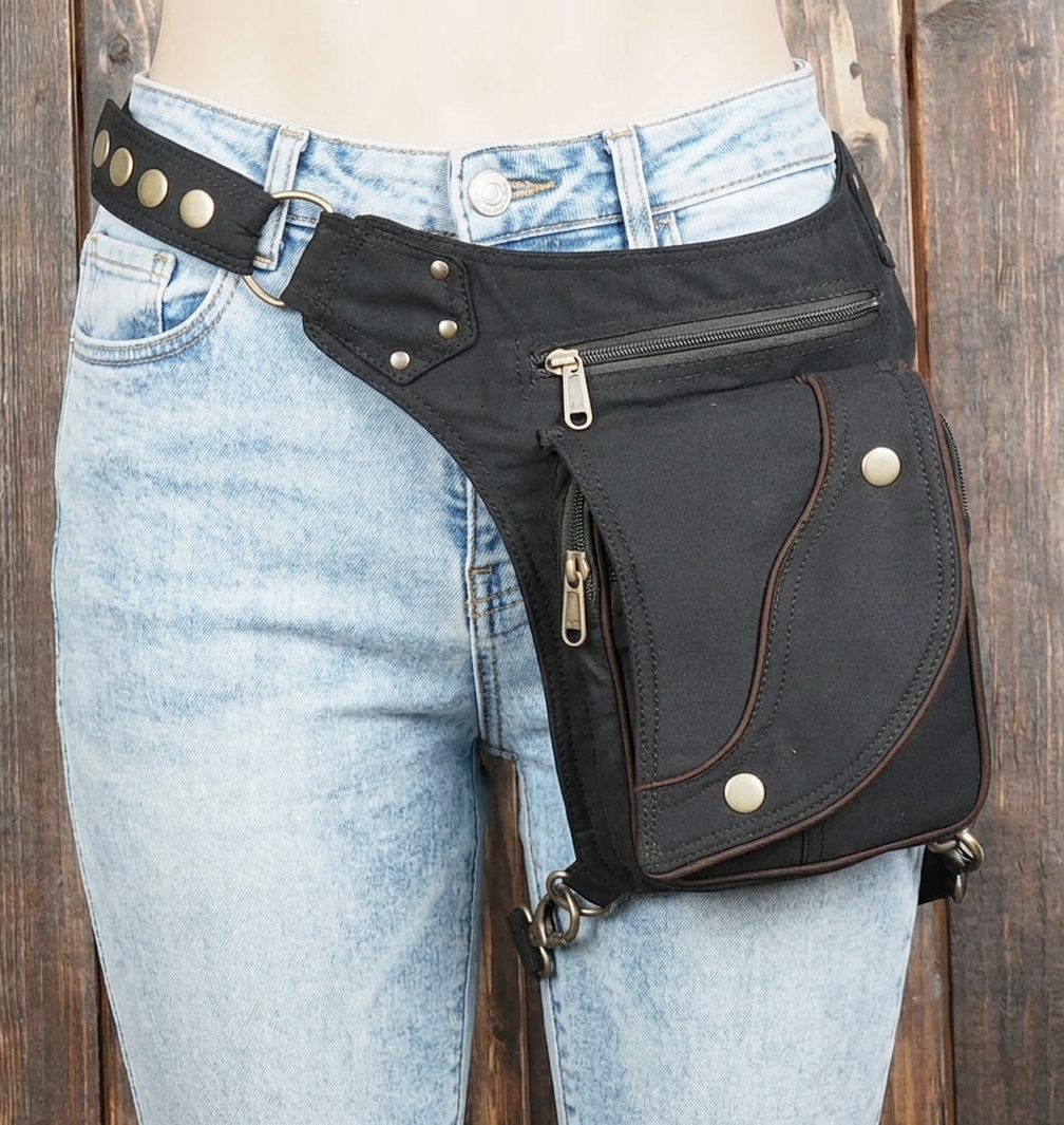 Comfortable, adjustable black cotton hip pack bag with a lower thigh security strap.