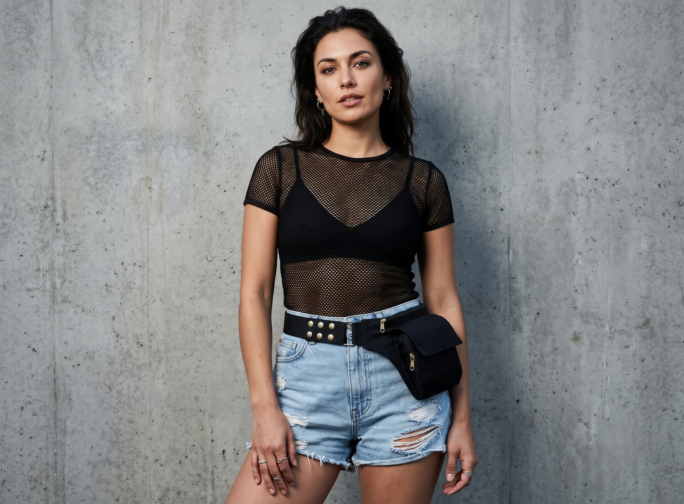 Minimalist black canvas fanny pack with adjustable brass hardware