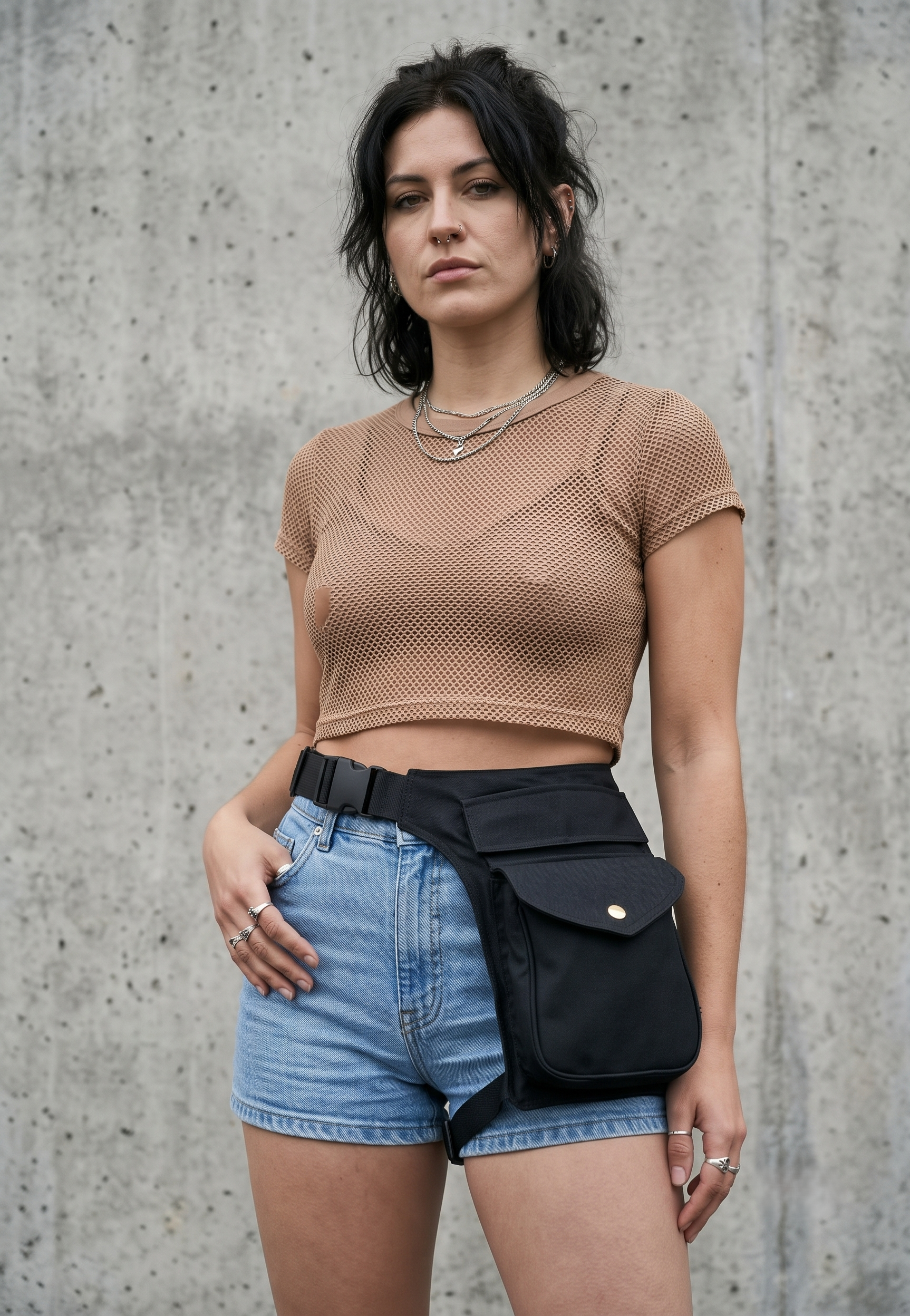 Black cotton waist pack with front flap compartment and buckle closure