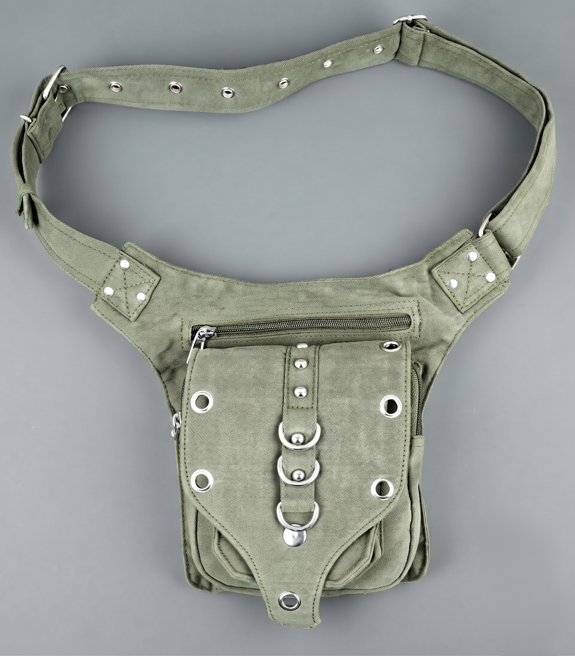 "A functional black canvas utility hip pack, complete with an adjustable strap and a row of three central O-ring details with silver studs." (General)