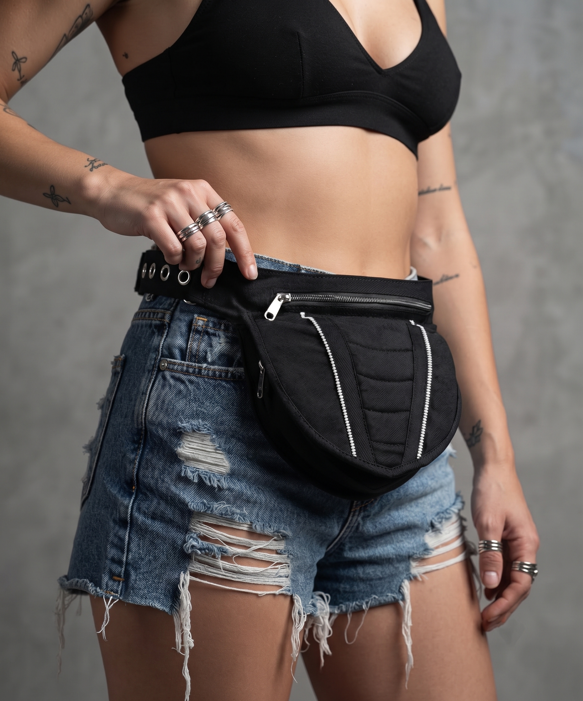 Cotton waist bag with quilted shield design, dual zippers & adjustable strap. Edgy, festival-ready, everyday use.