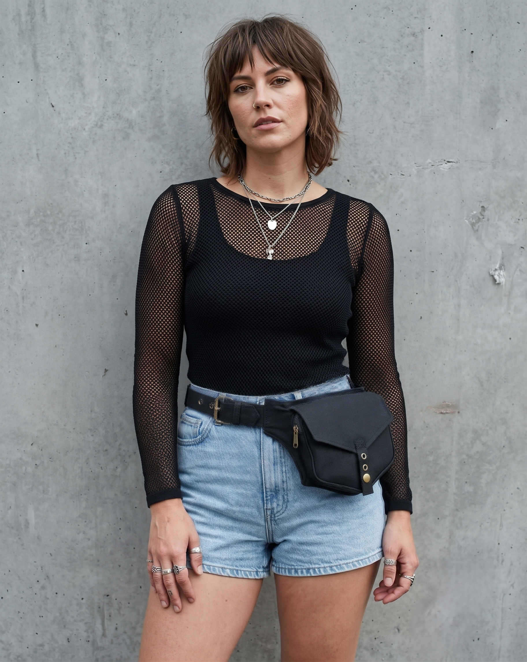 Black cotton utility belt bag with adjustable waist strap and front zipper pocket