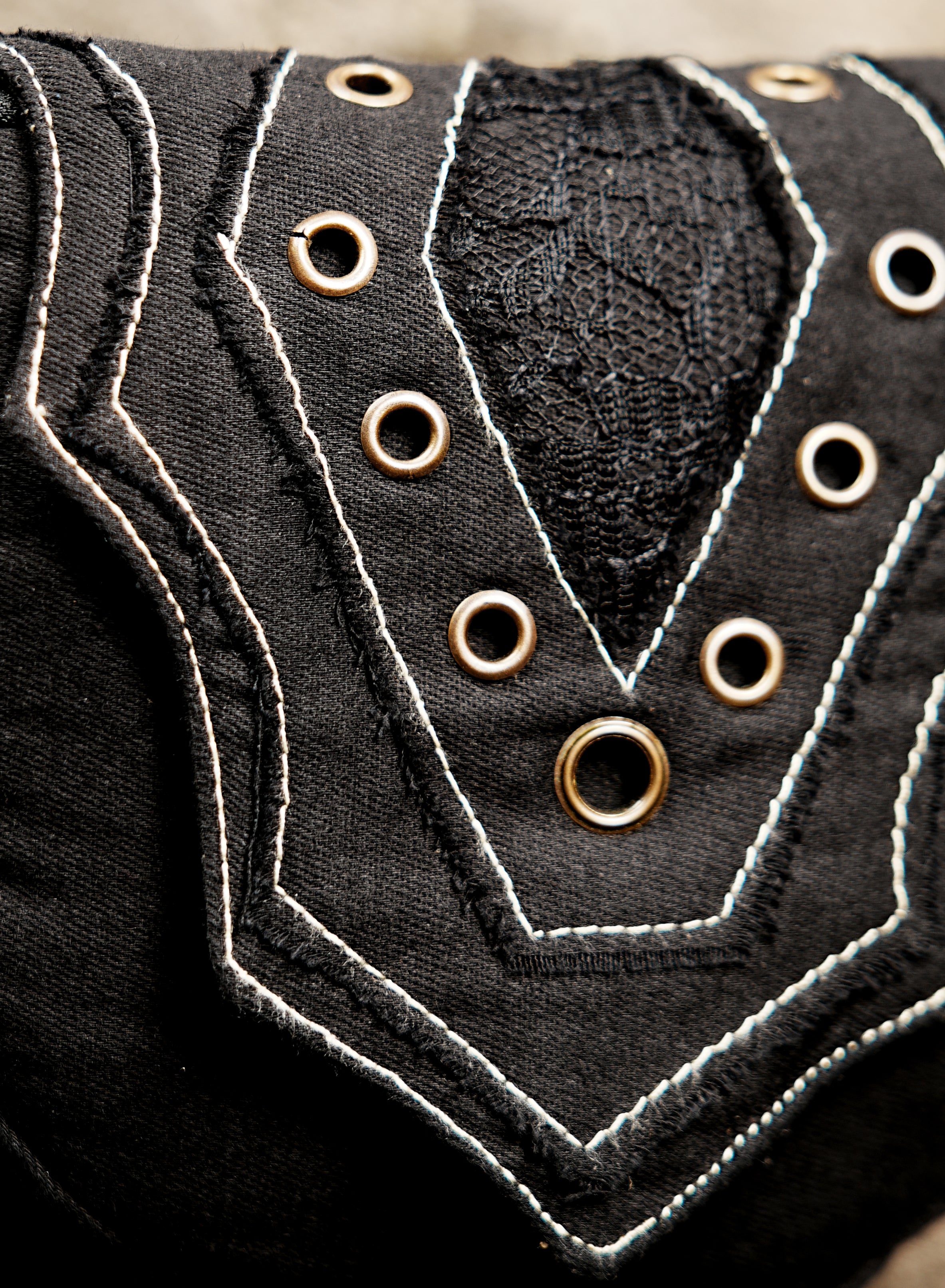 Black hip pouch belt with eyelet detailing for festivals and travel