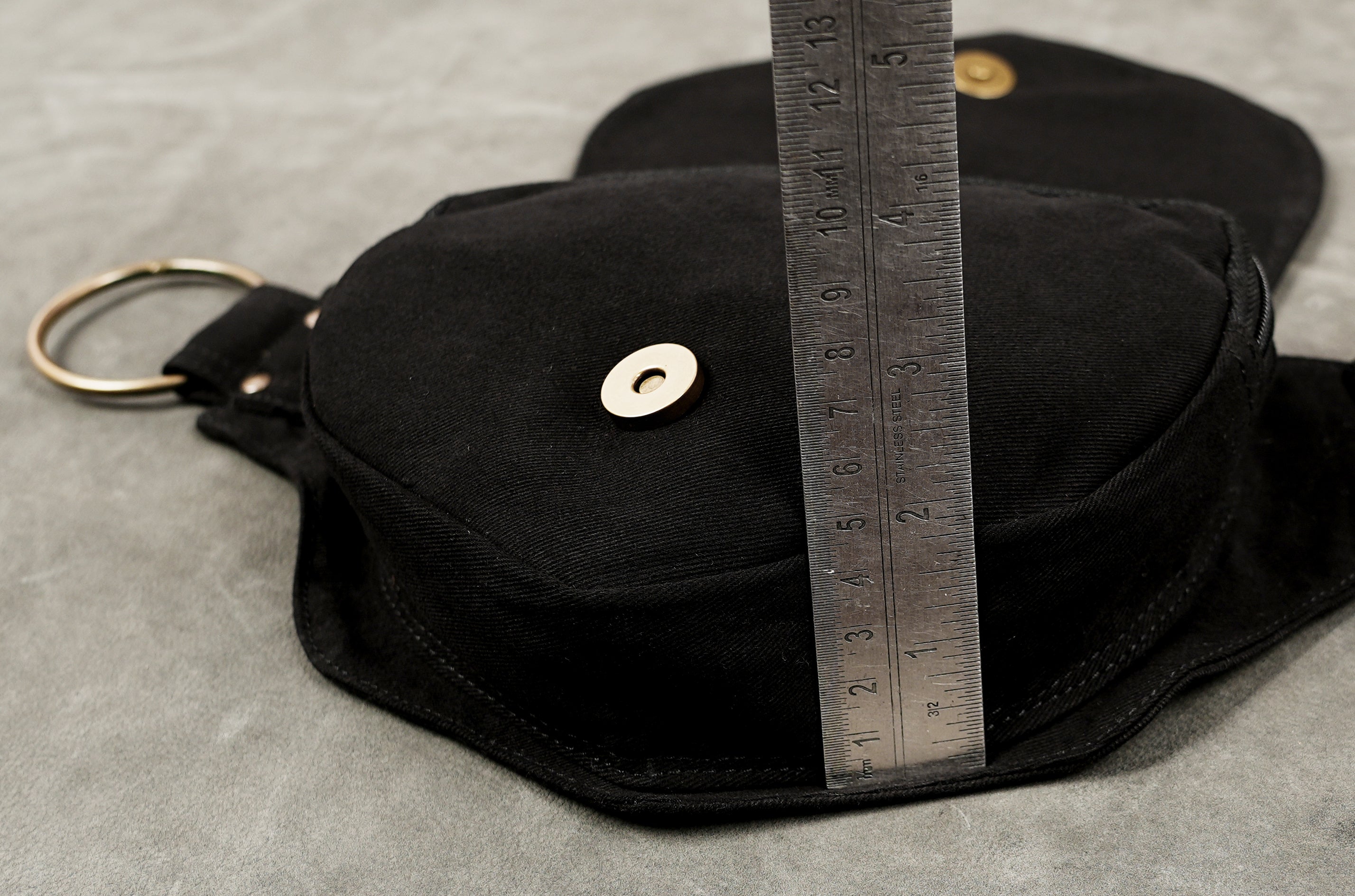 Black cotton waist pouch belt with silver eyelets and rivets