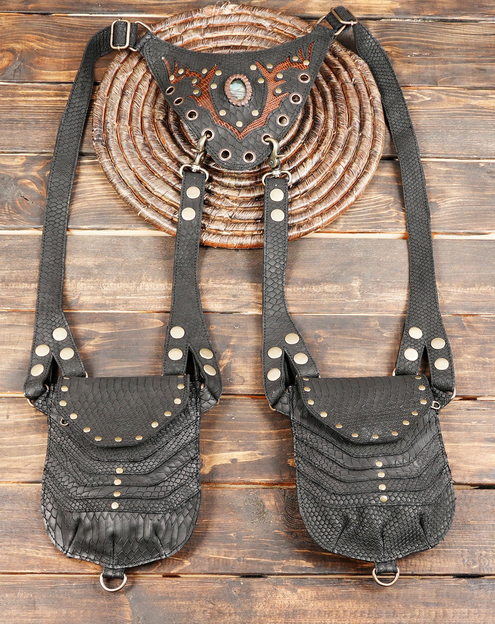 Black leather dual pouch holster with textured finish and stud detailing