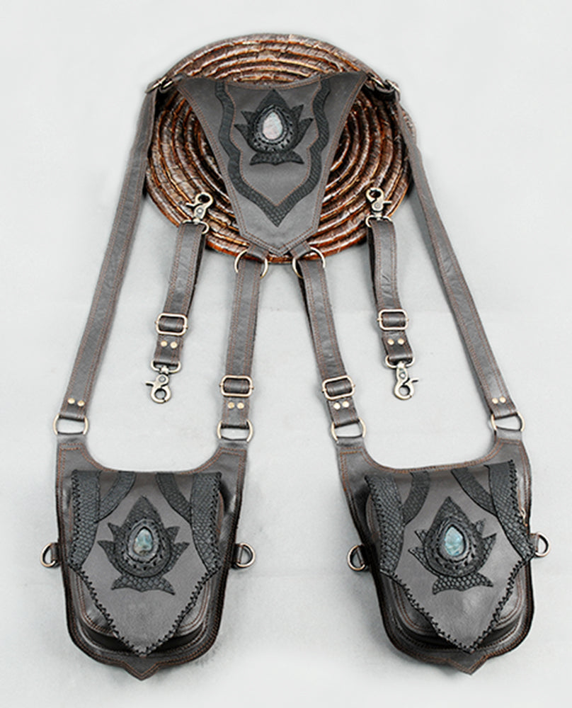 “Stylish festival holster made from white leather with black applique accents”