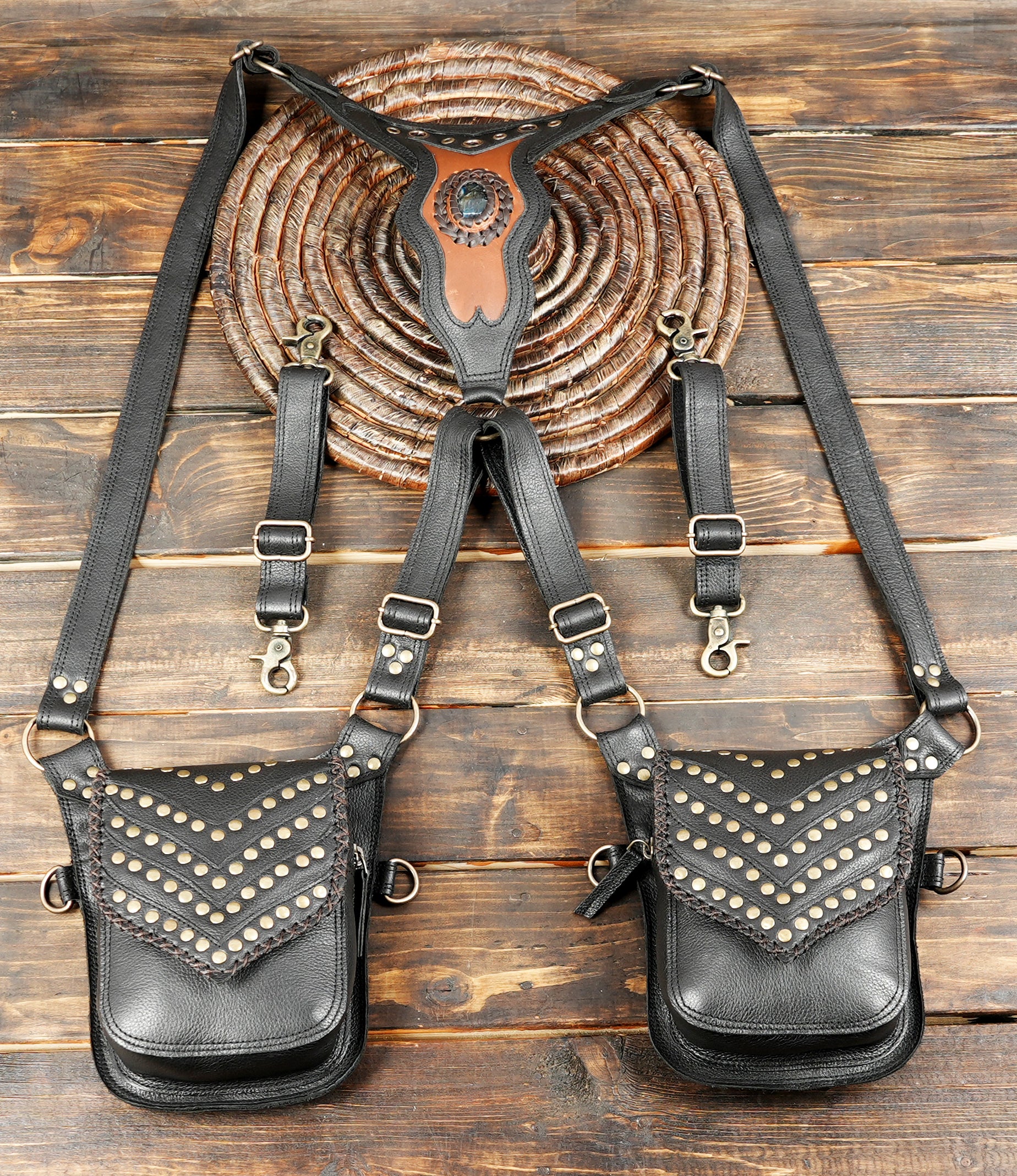 Black leather dual holster harness with studded pouch design