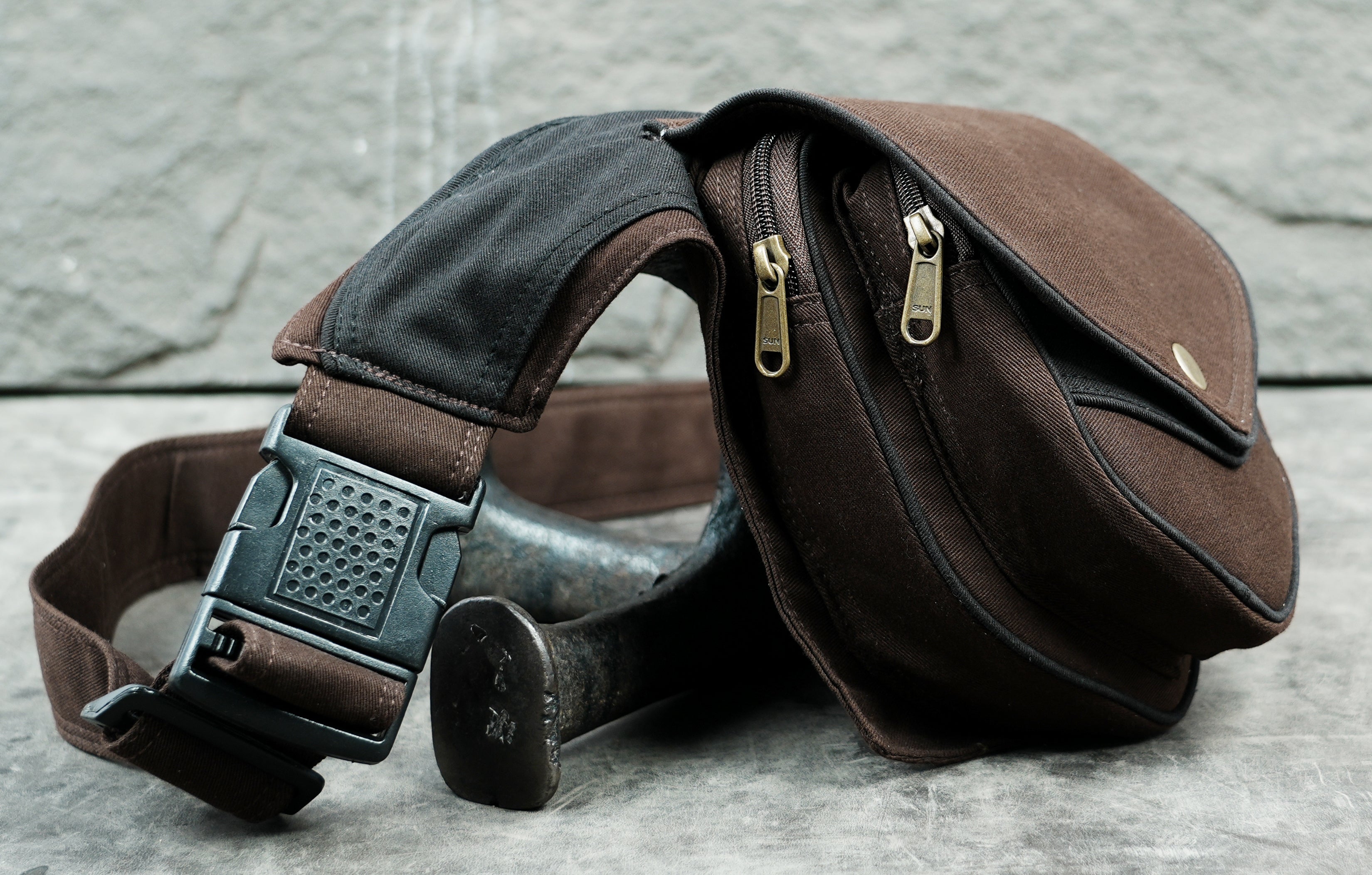 Handcrafted cotton pocket belt in brown with black piping edges