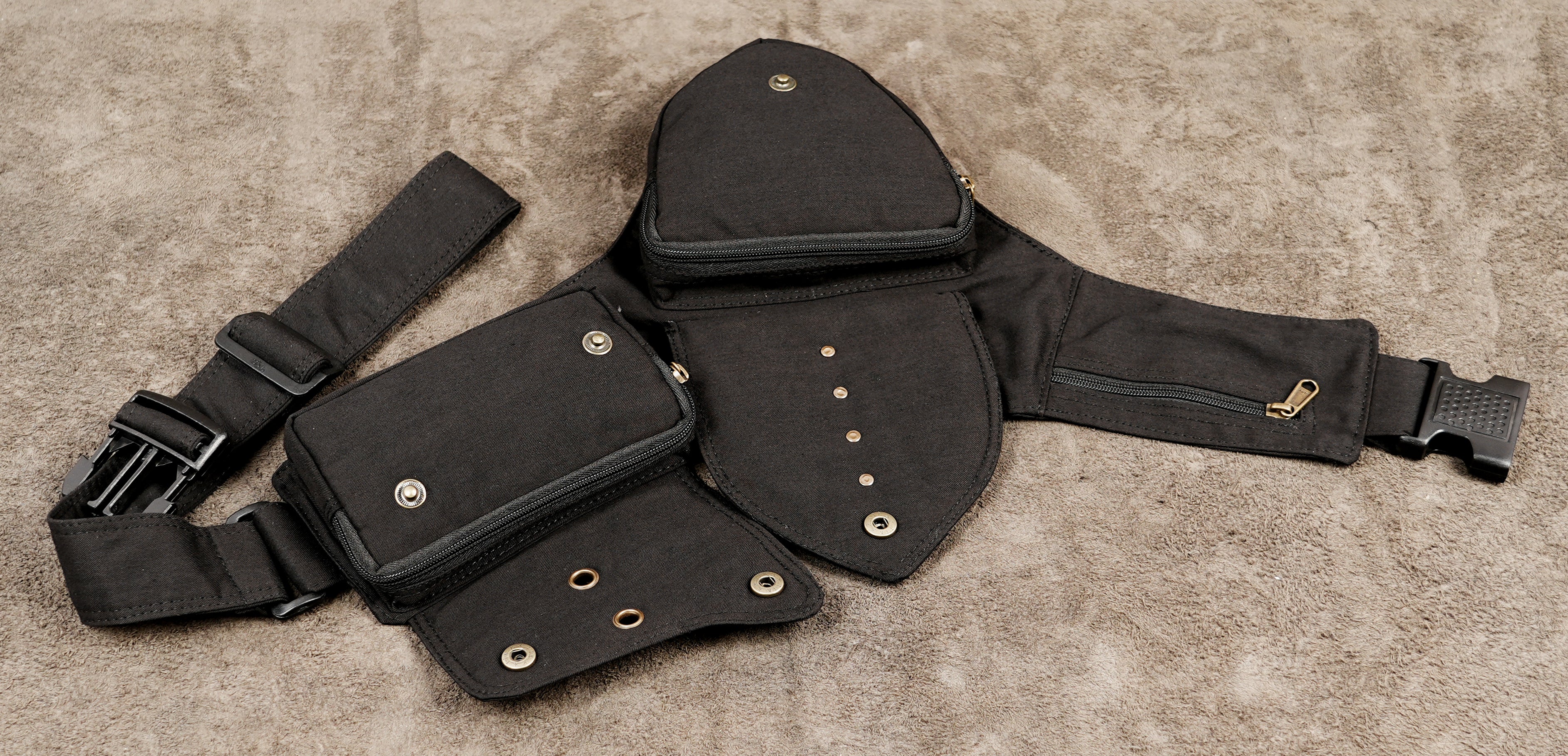 Black cotton pocket belt with brass eyelets and snap closures
