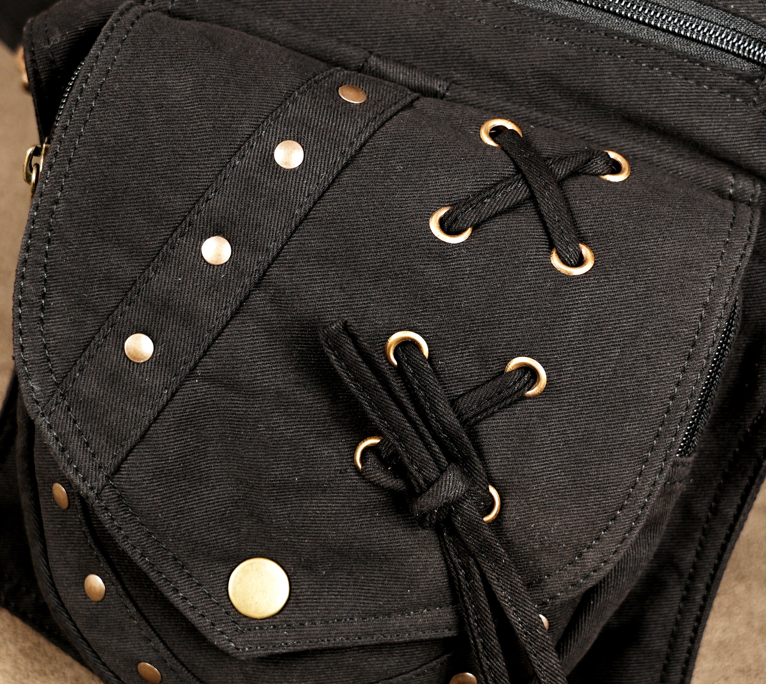 Black cotton belt bag ideal for concerts, hikes, or urban use