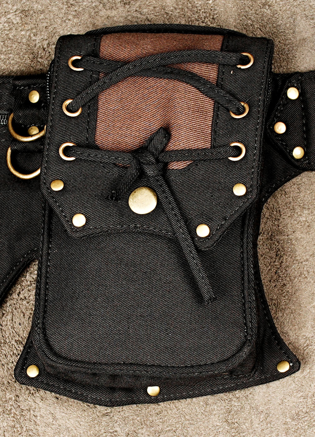 Adjustable cotton waist belt with eyelet strap and brass buckle