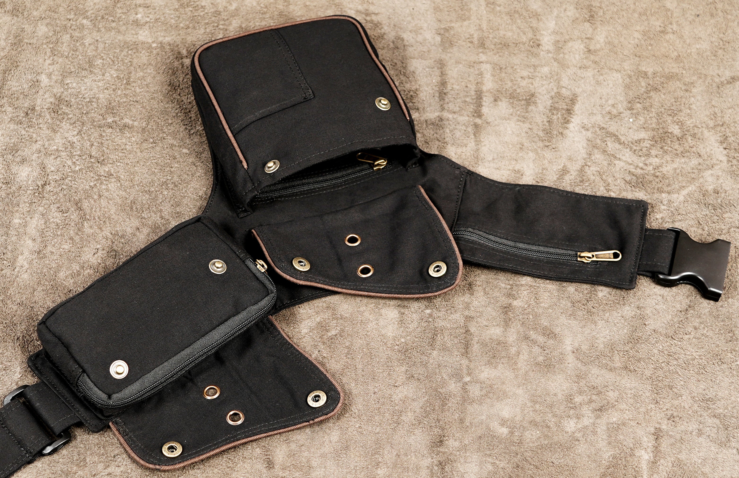 Black hip pouch belt with front flap pocket and phone compartment