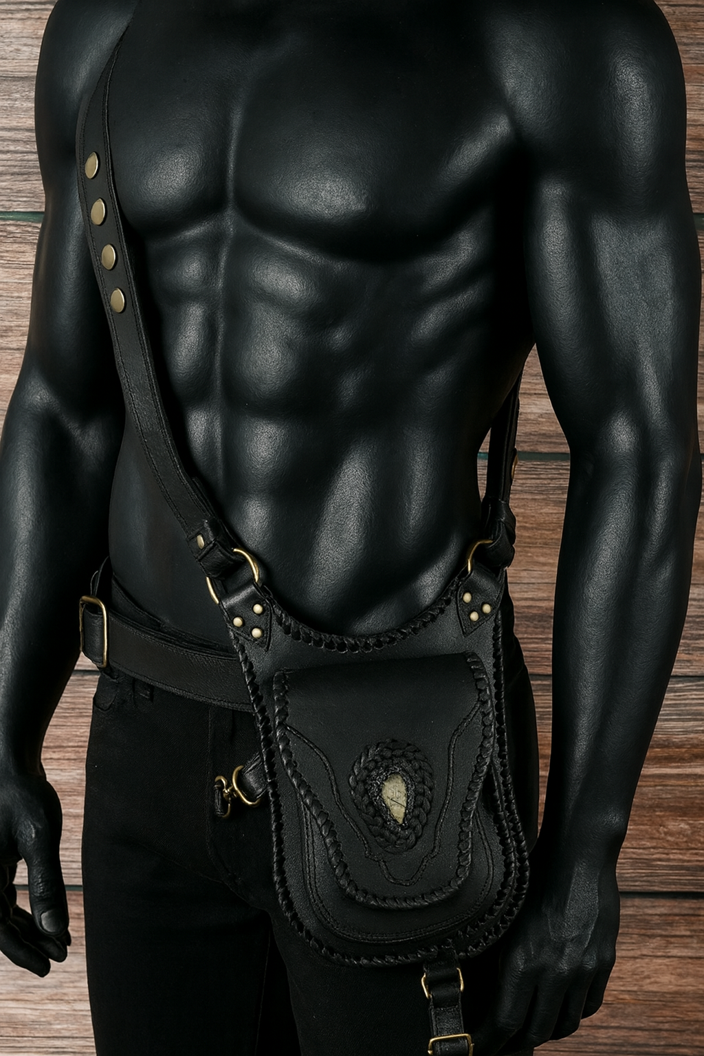 "Adjustable leather holster bag with intricate front detailing"