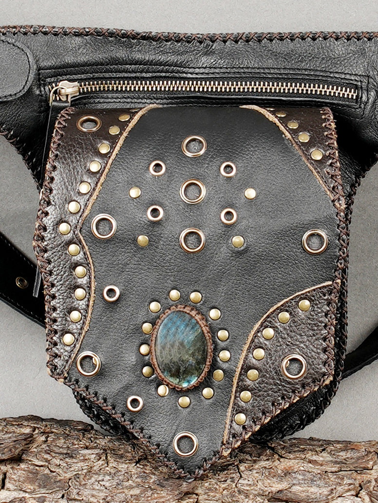 Handcrafted leather waist bag with zipper closure and stud design