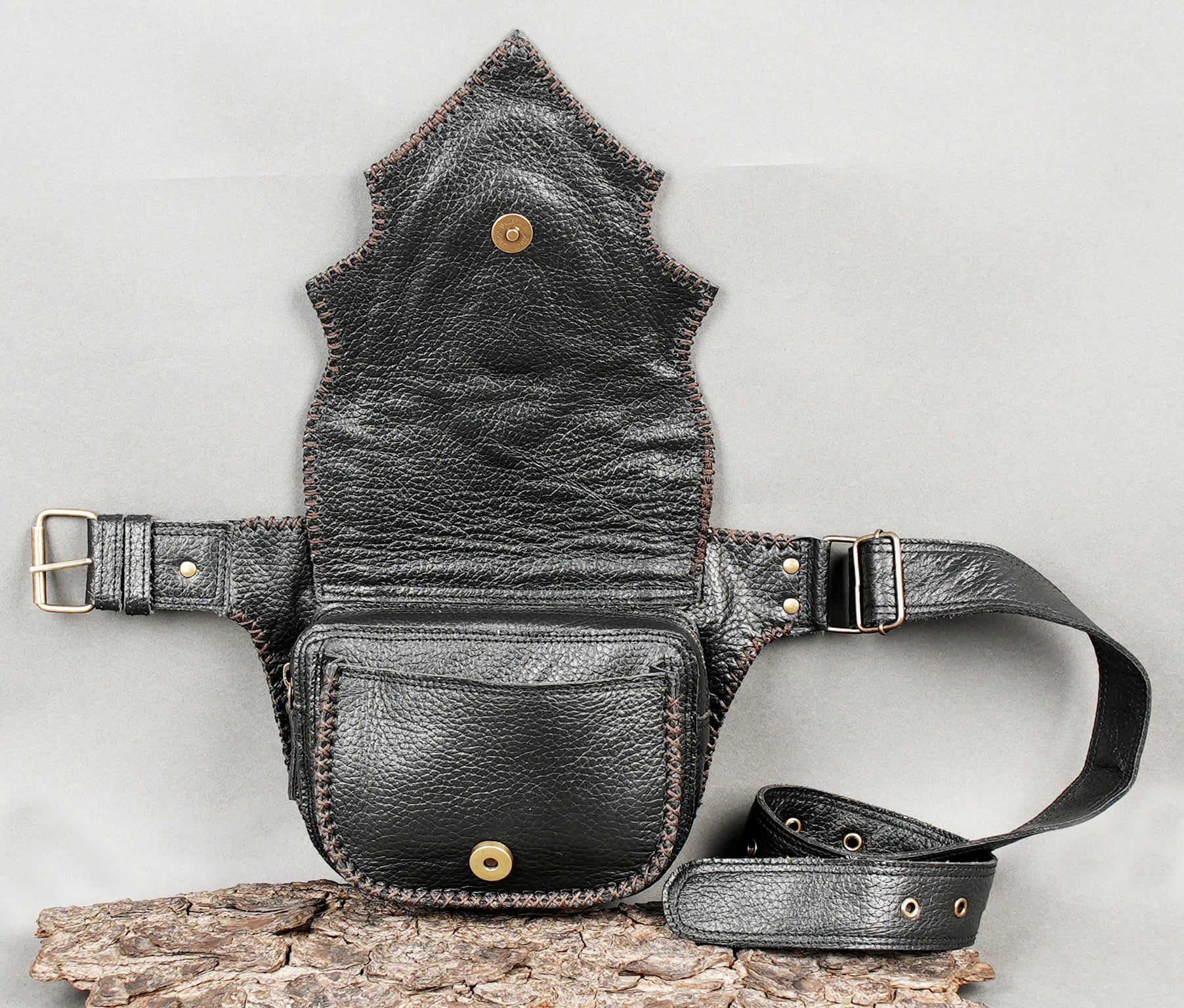 Black genuine leather waist bag with sculpted flap and stone
