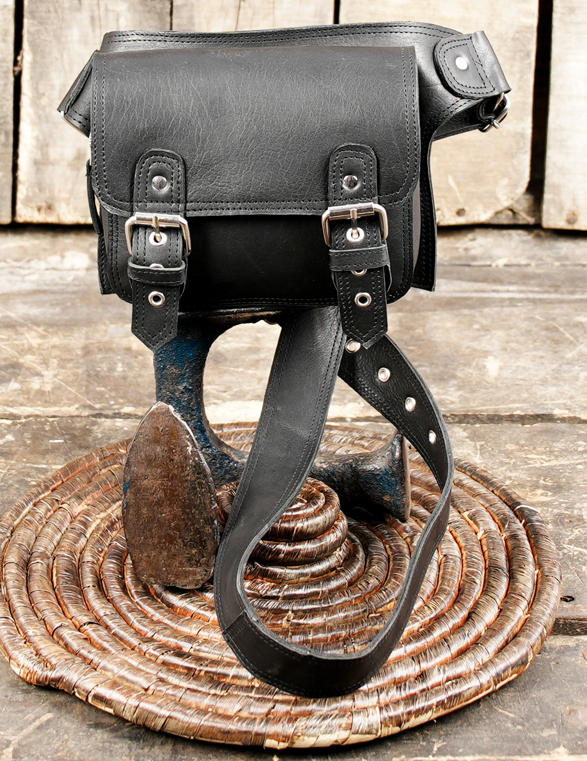 Black leather waist belt with front flap and straps