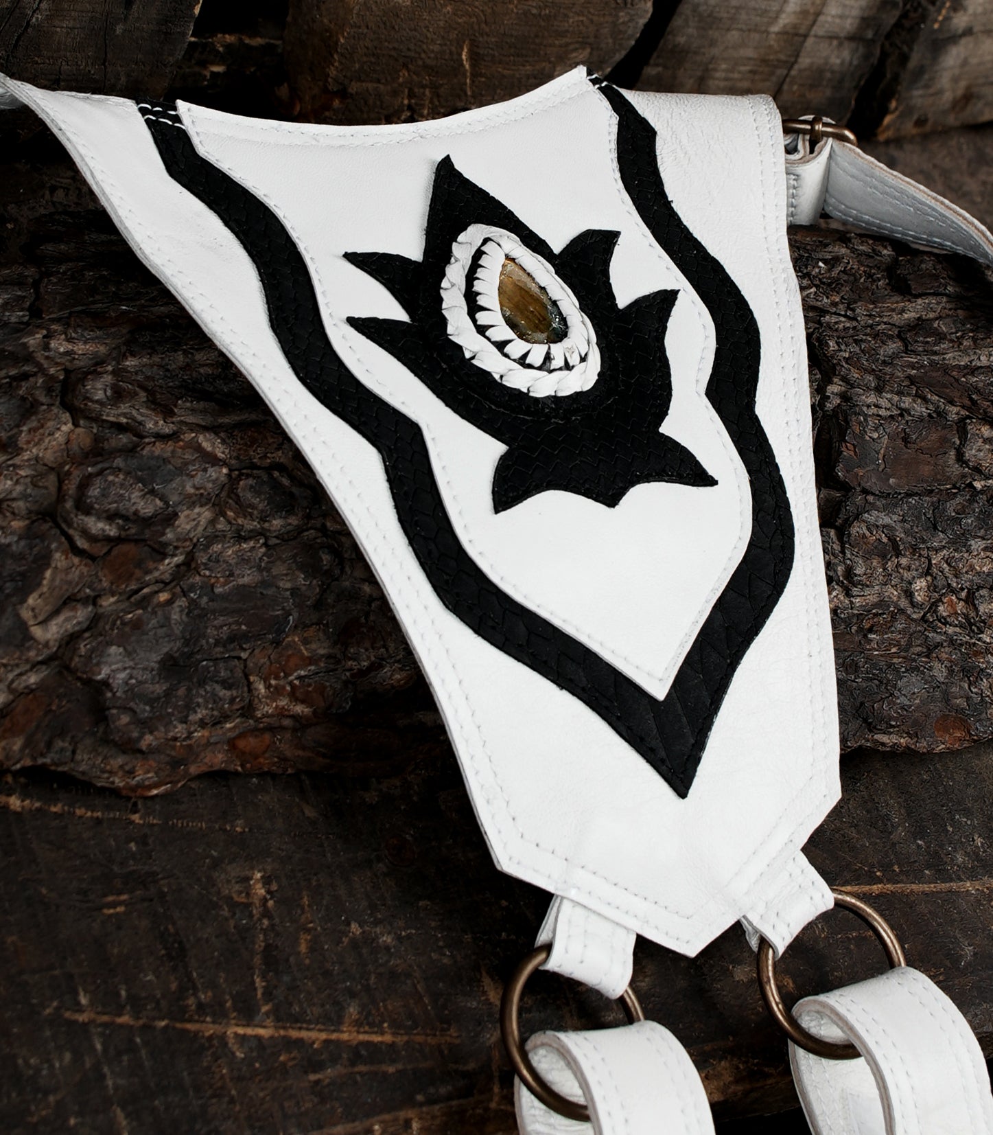 “Handmade leather holster in white with dual pockets and bold black accents”