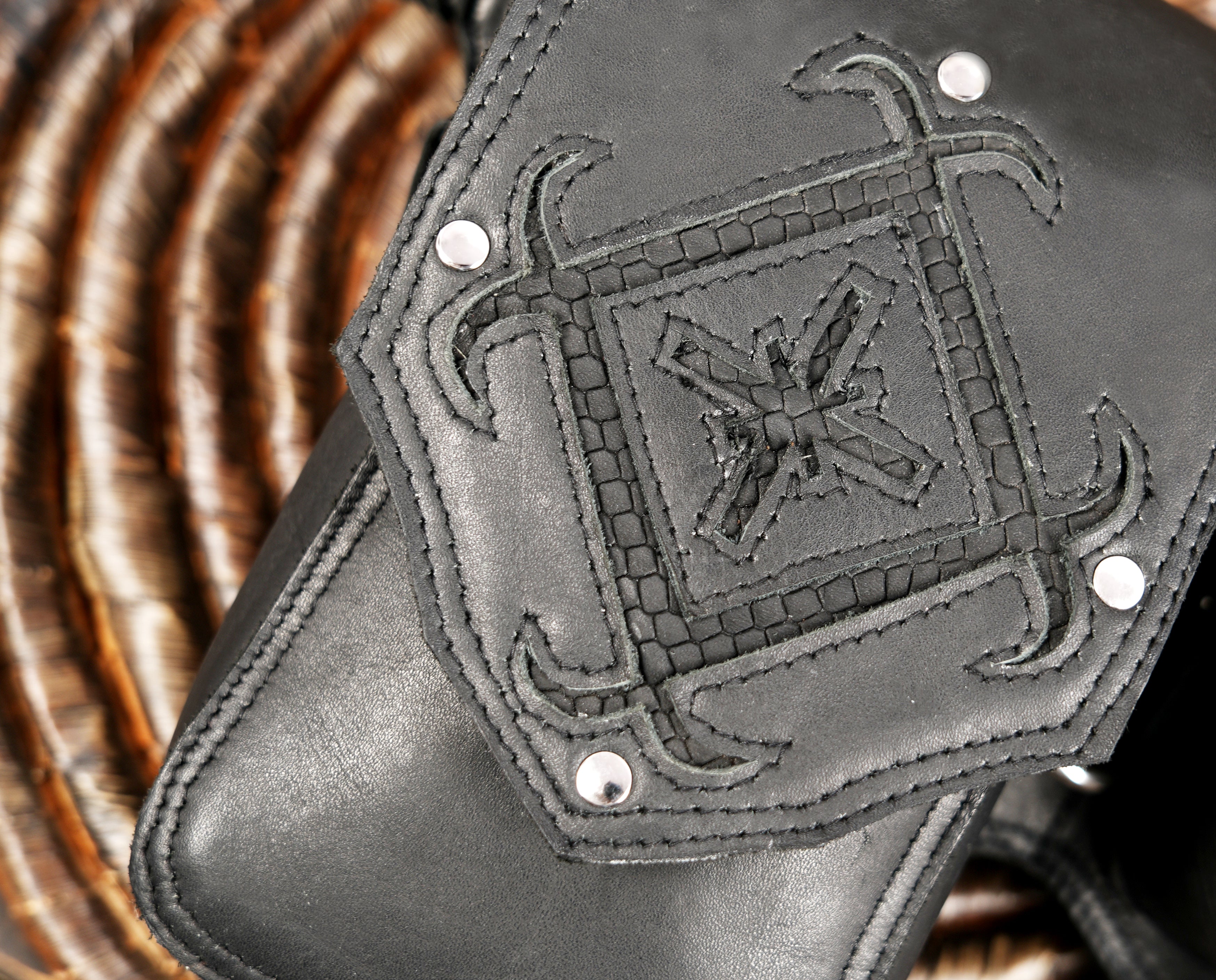 Black leather hip bag with adjustable strap and metal hardware