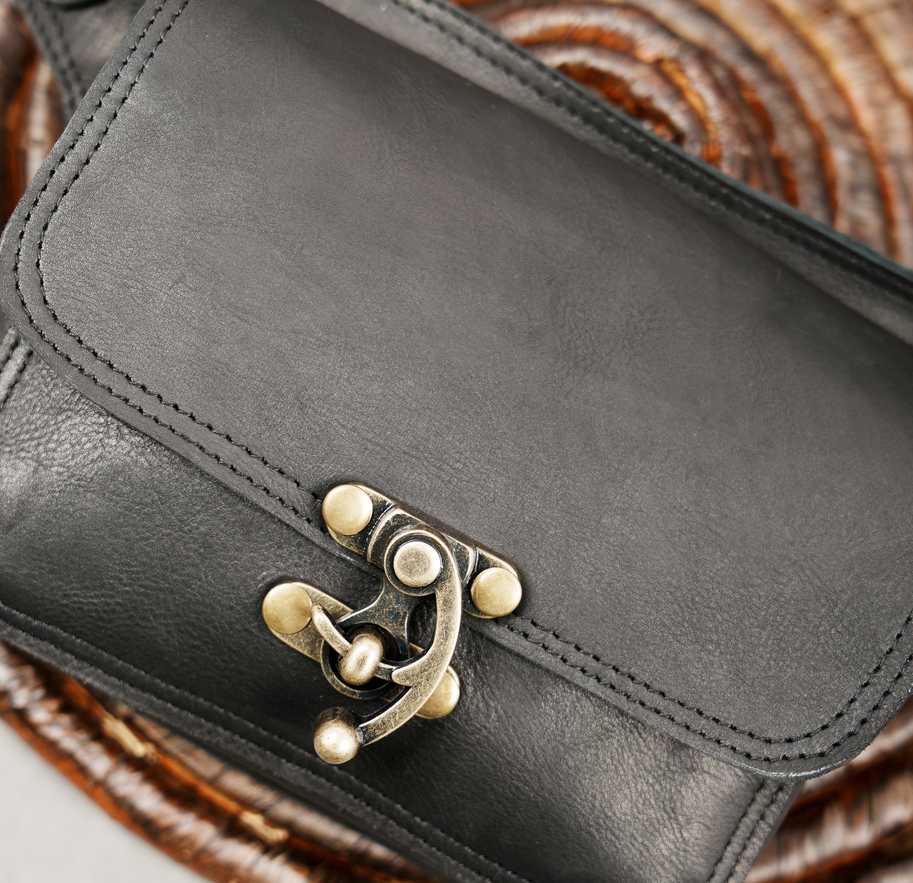 Minimalist black leather belt bag with adjustable strap