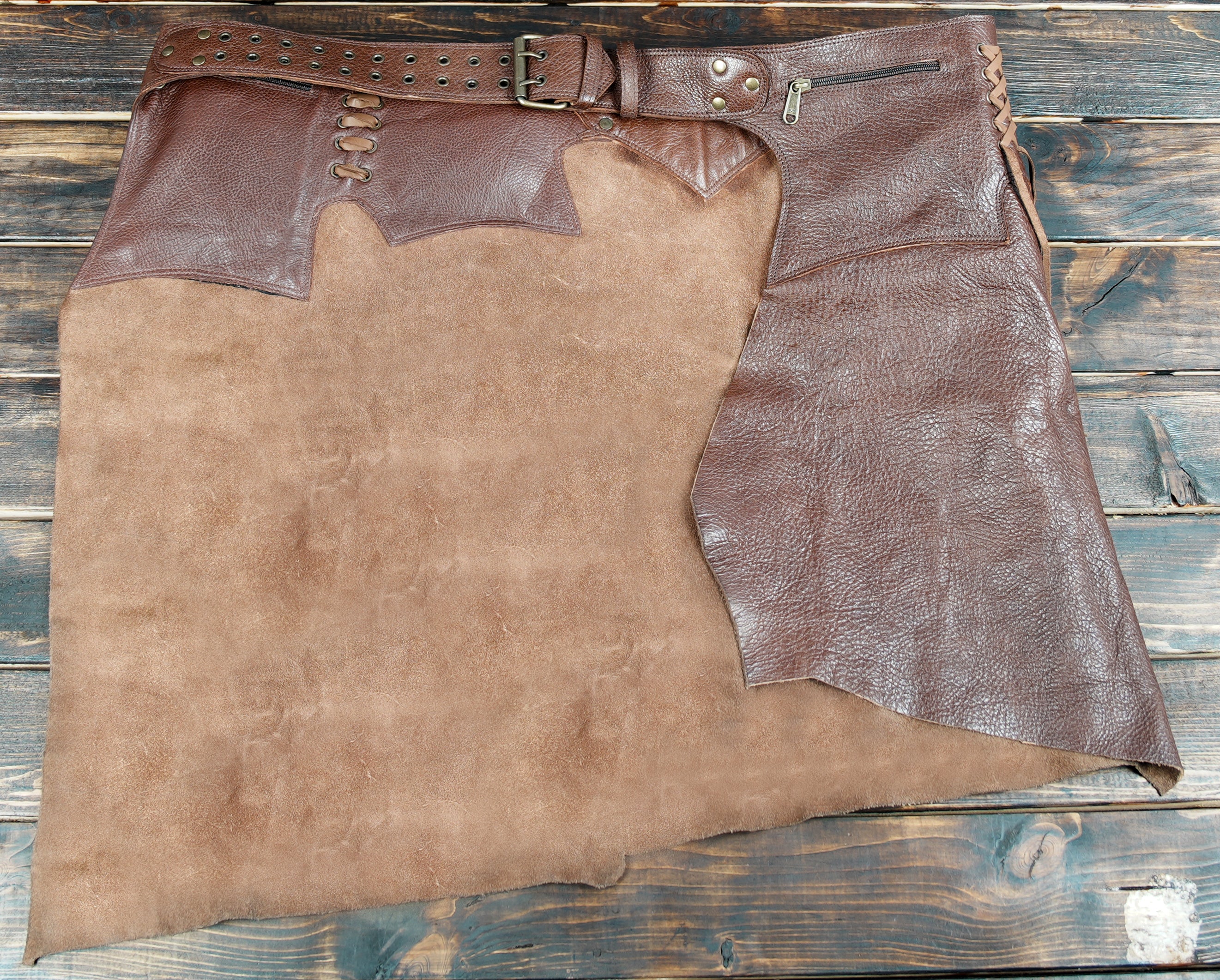 Handmade leather skirt with belt pouches, perfect for renaissance, cosplay, and fantasy events.