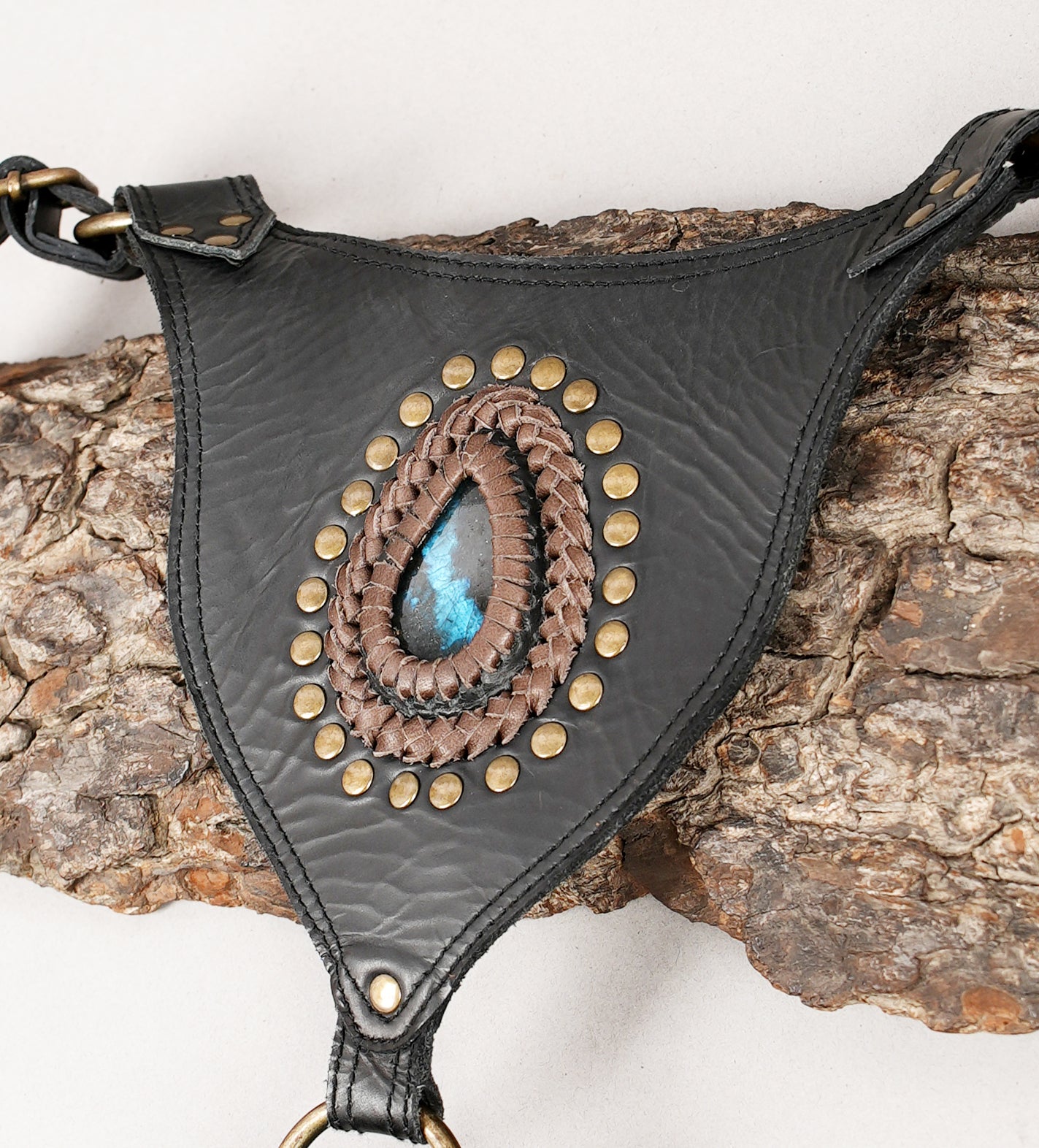 Artisan leather holster with mixed textures and center stone