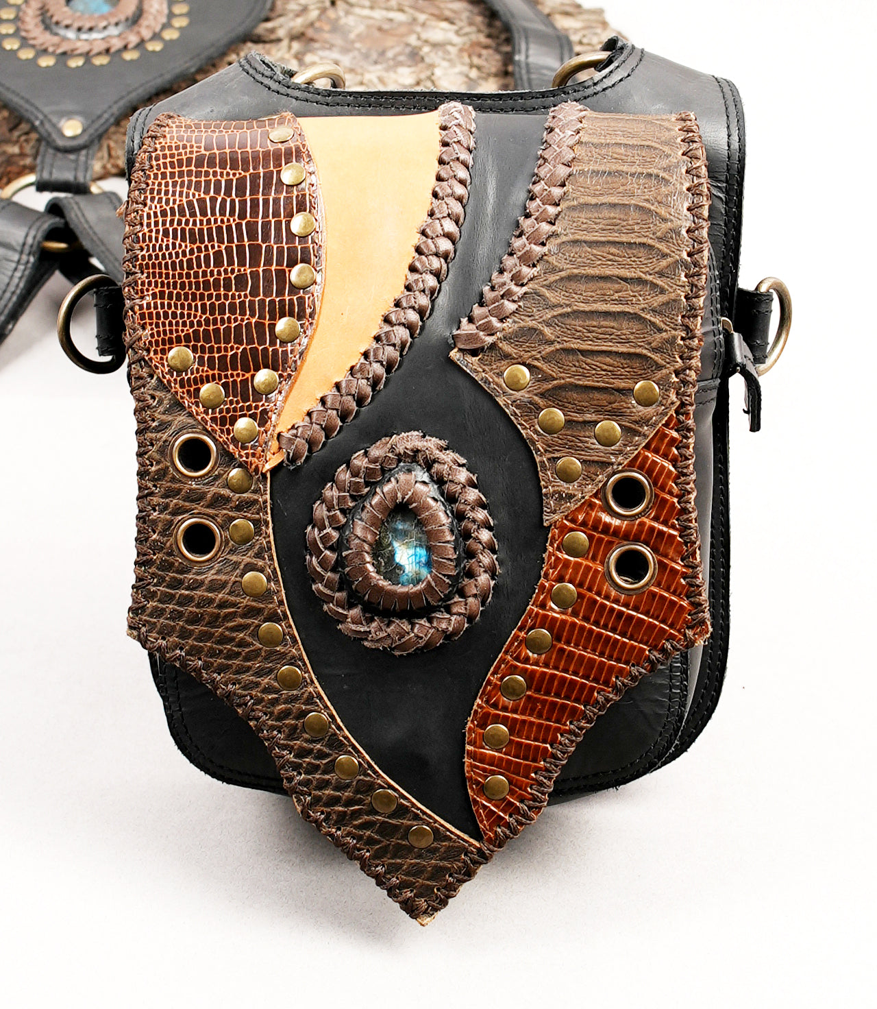 Black and brown leather shoulder rig with decorative studs