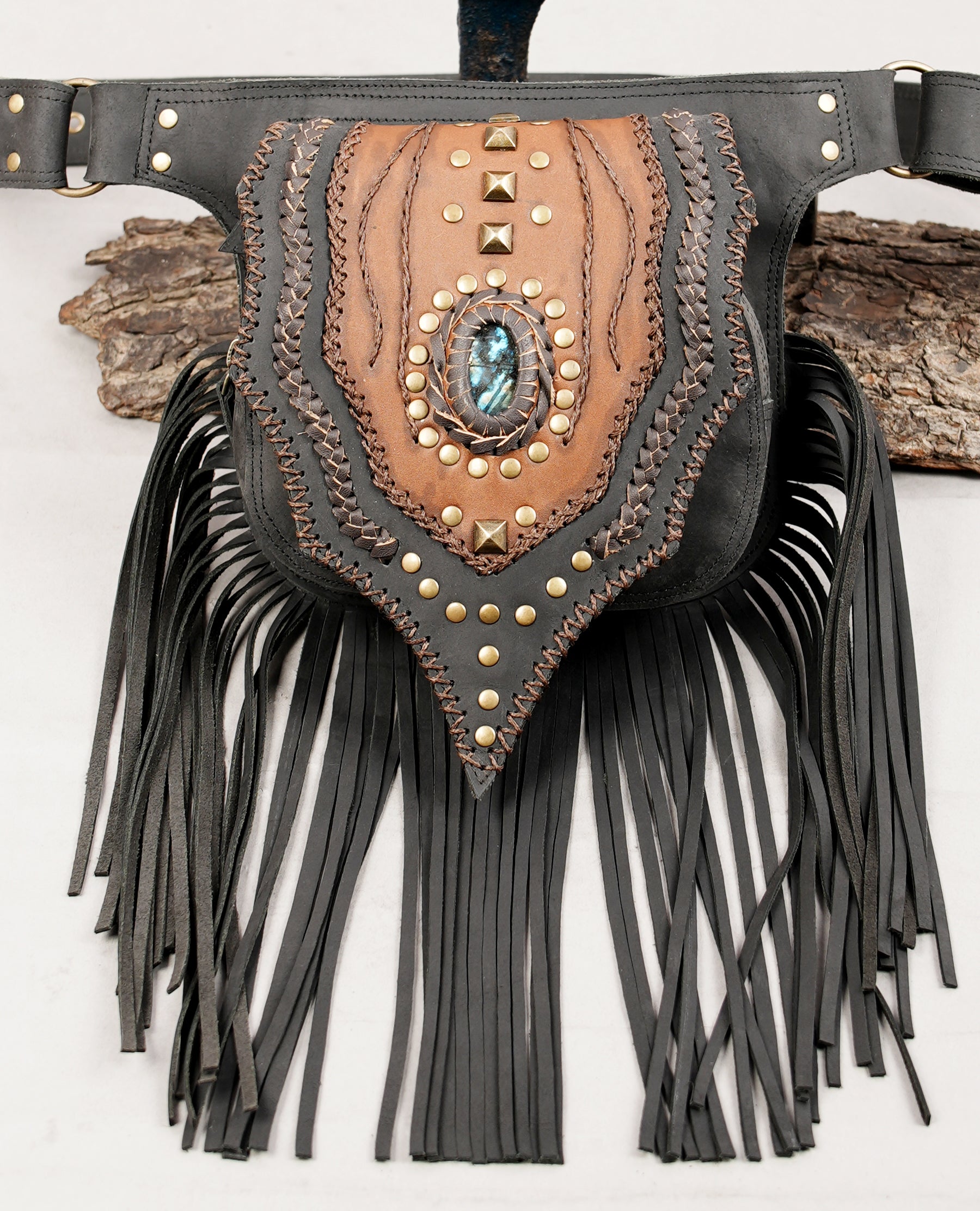 Brown and black leather waist bag with gemstone and handmade stitching.