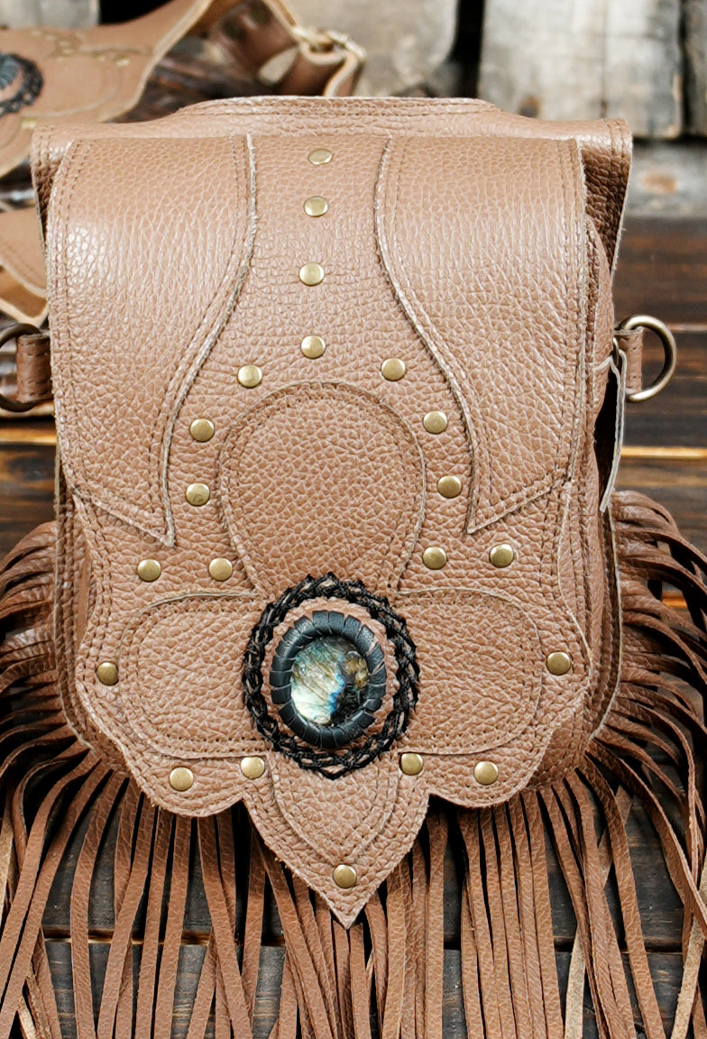 Festival style leather holster with twin pouches and decorative stone