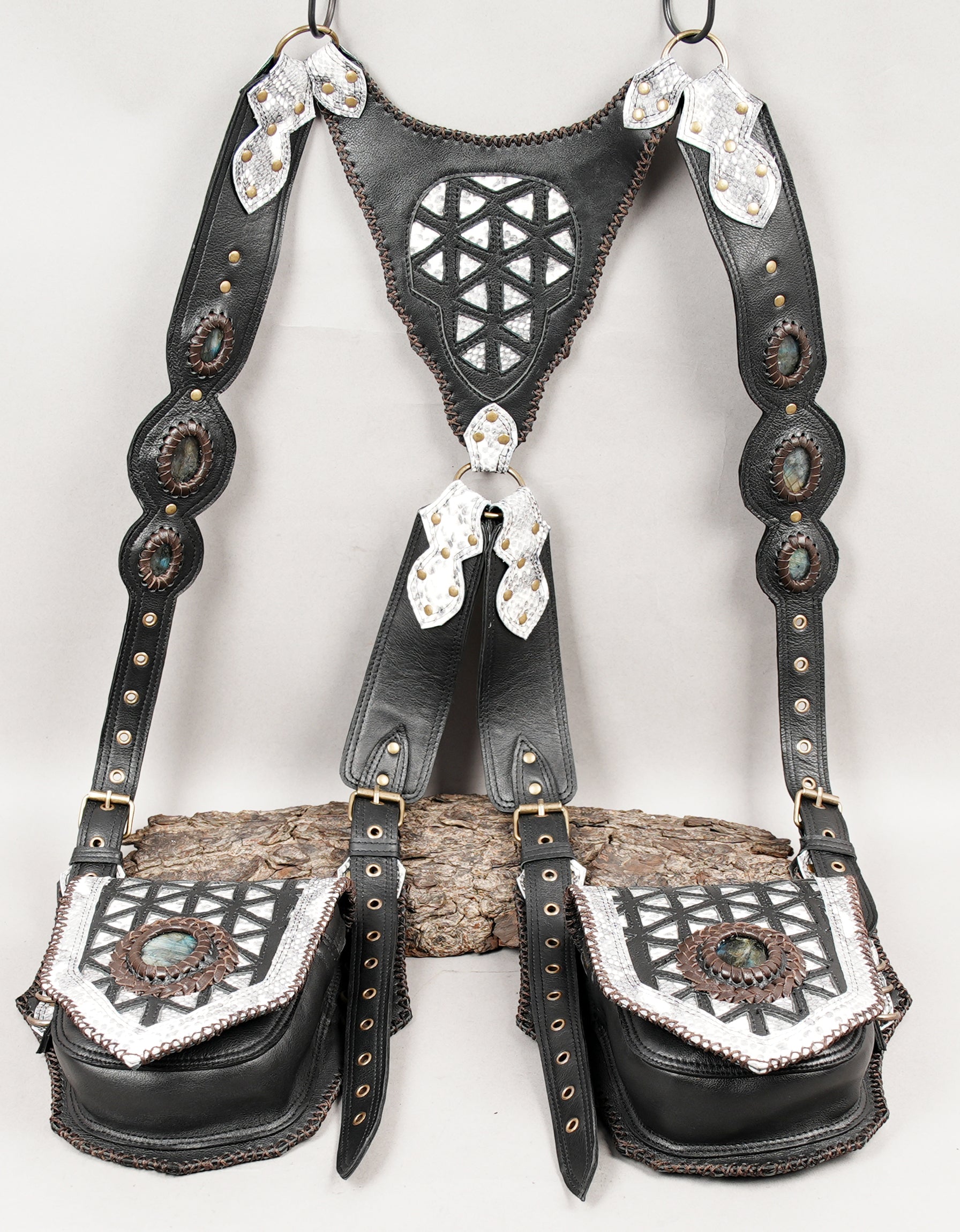 Black leather shoulder harness with silver snake-skin style accents