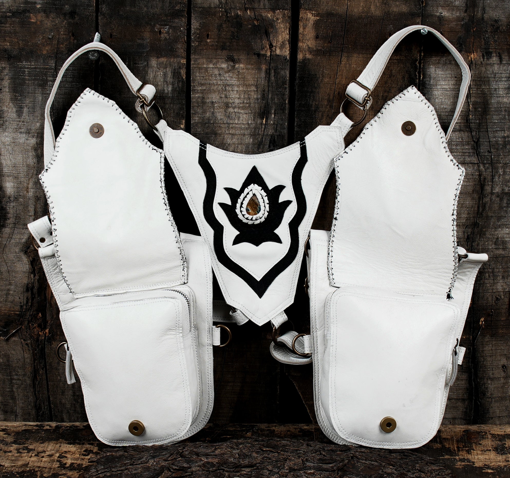 “Bold white and black leather harness holster for festivals and cosplay”