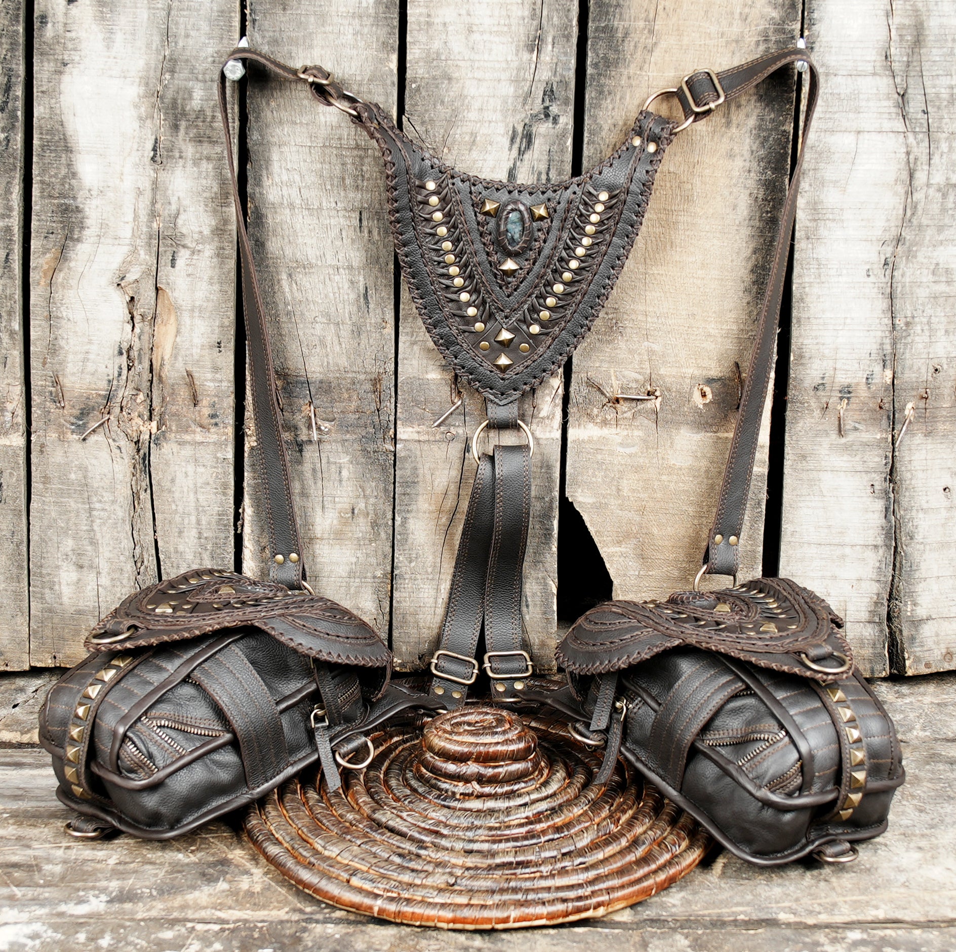 “Artisan-crafted dark brown leather holster with layered flap design”