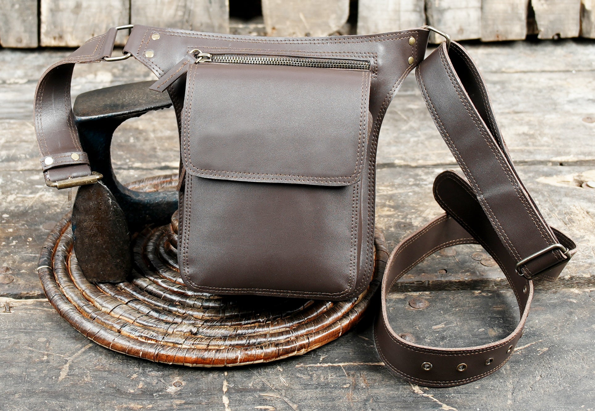 Brown leather waist holster bag with secure stitching