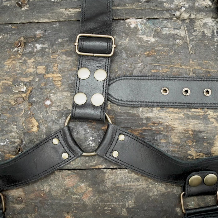 "Black leather festival holster with decorative rivets"