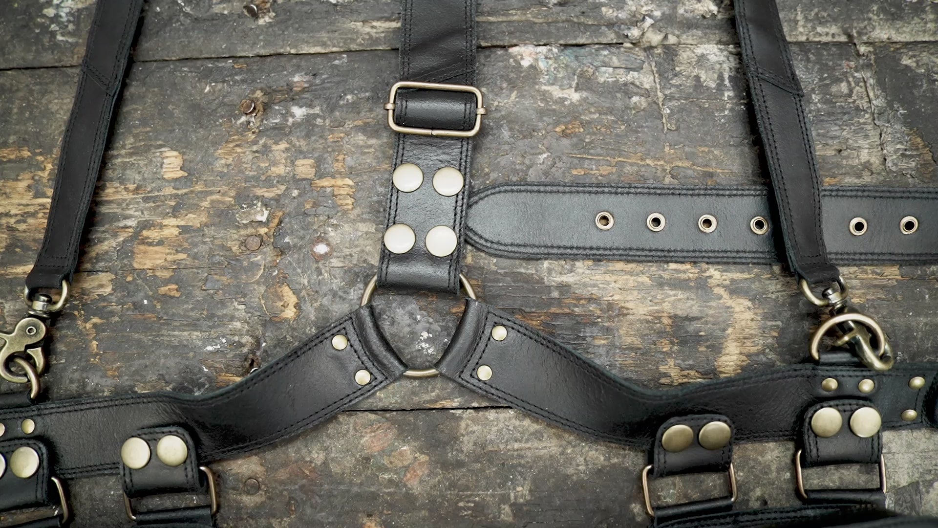 "Black leather festival holster with decorative rivets"