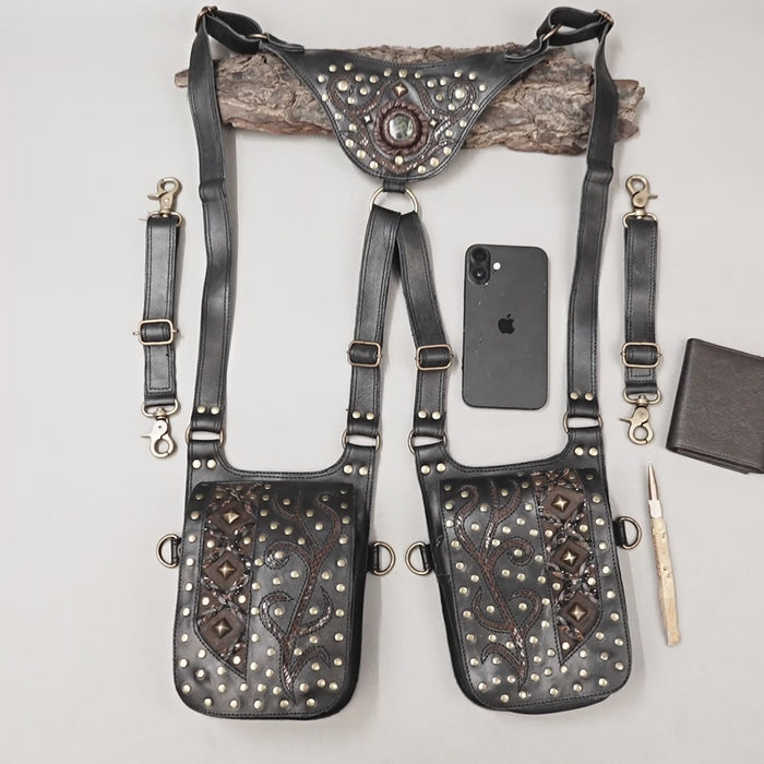 Black leather utility holster with decorative studs and gemstone buckle detail