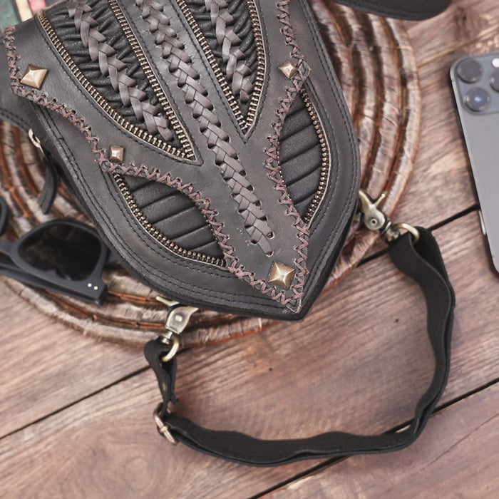Artisan black leather thigh pouch with rustic festival design
