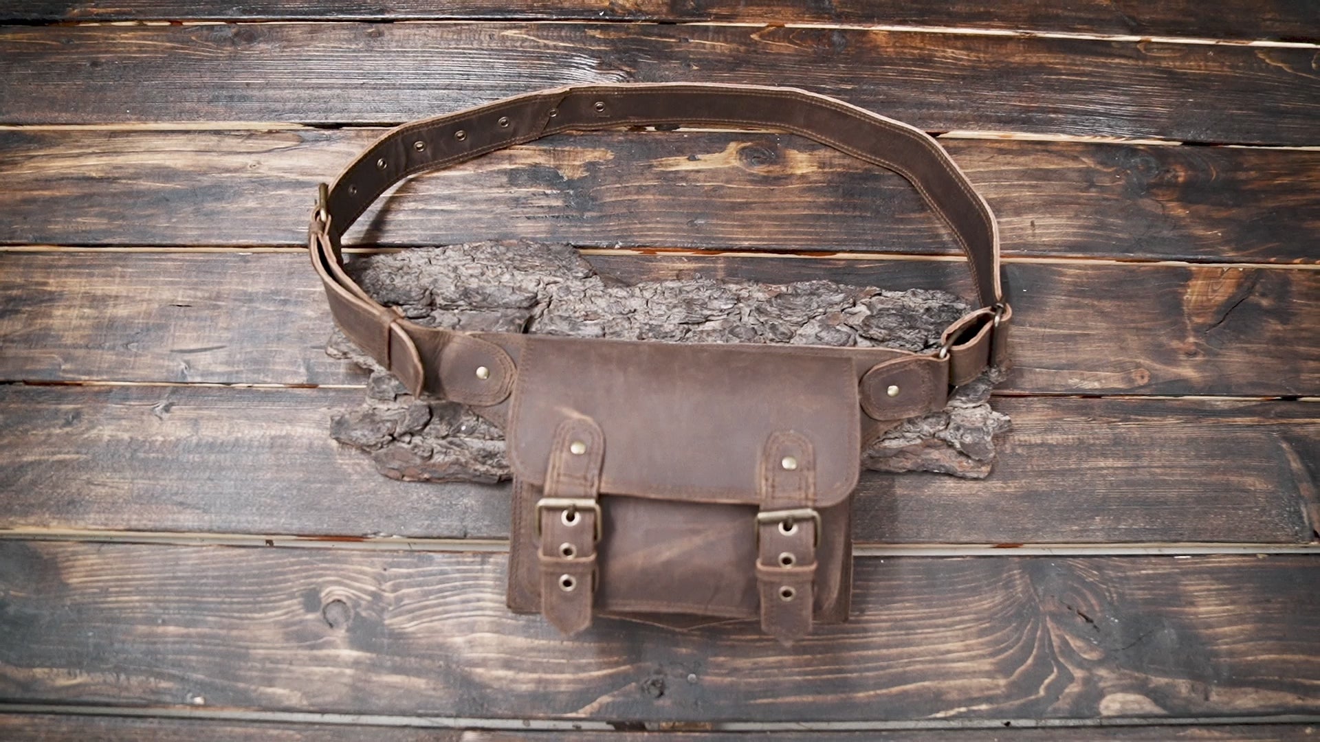 Handmade brown leather waist bag with vintage buckle straps