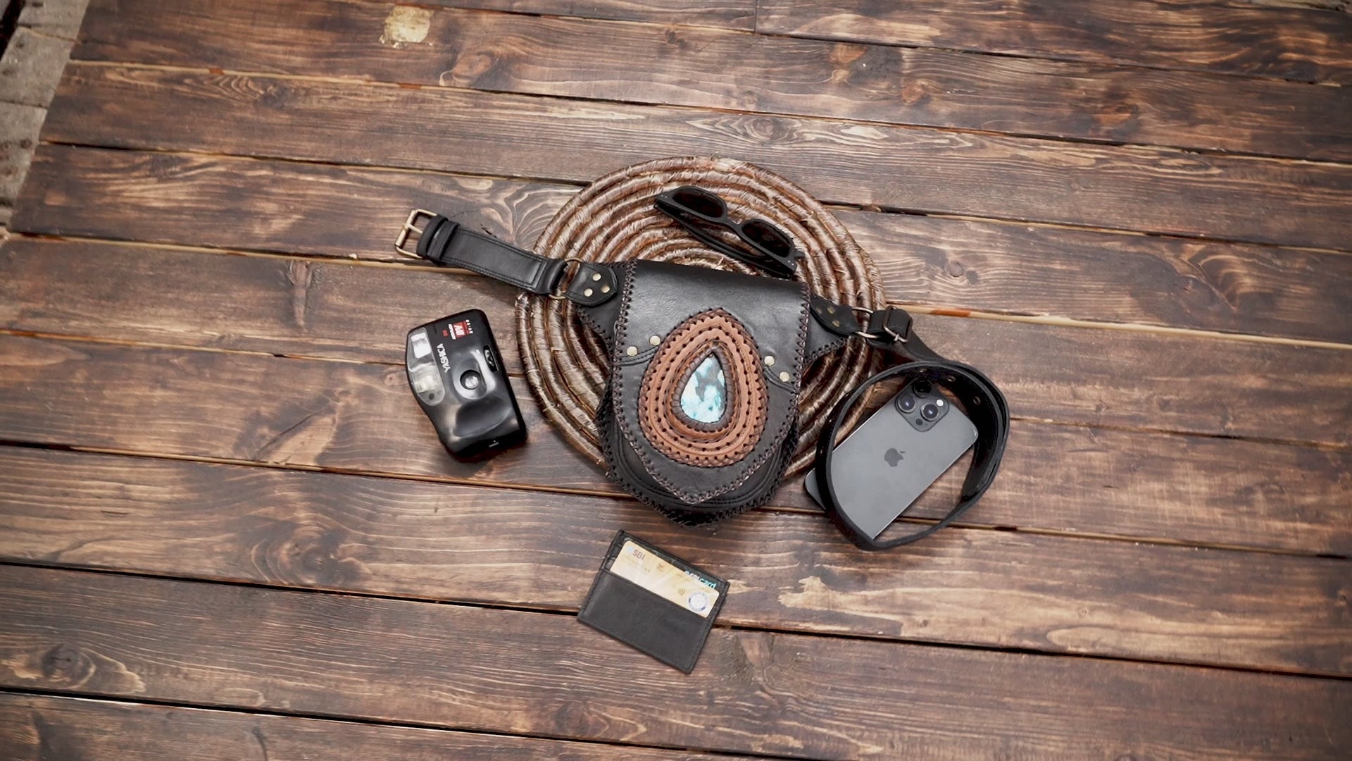 Close-up of artisan leather waist bag with turquoise gemstone