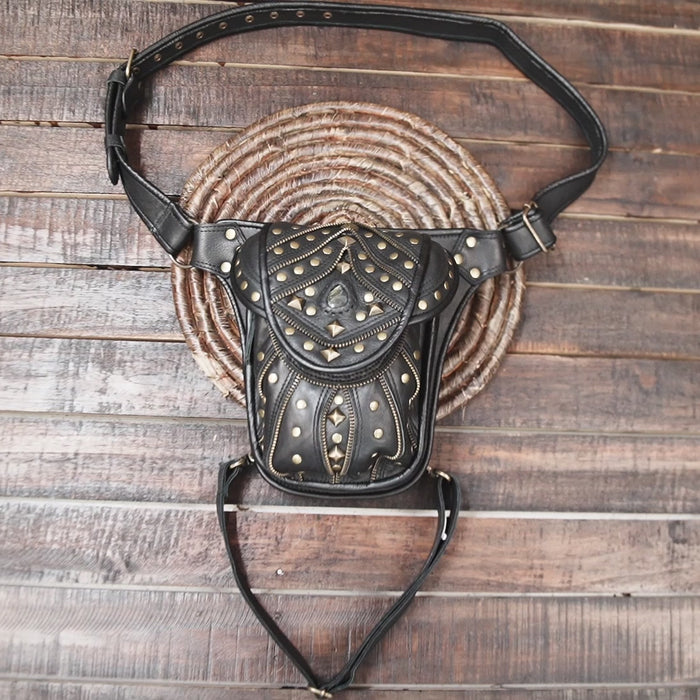 black leather holster belt bag with gold studs and gemstone centerpiece