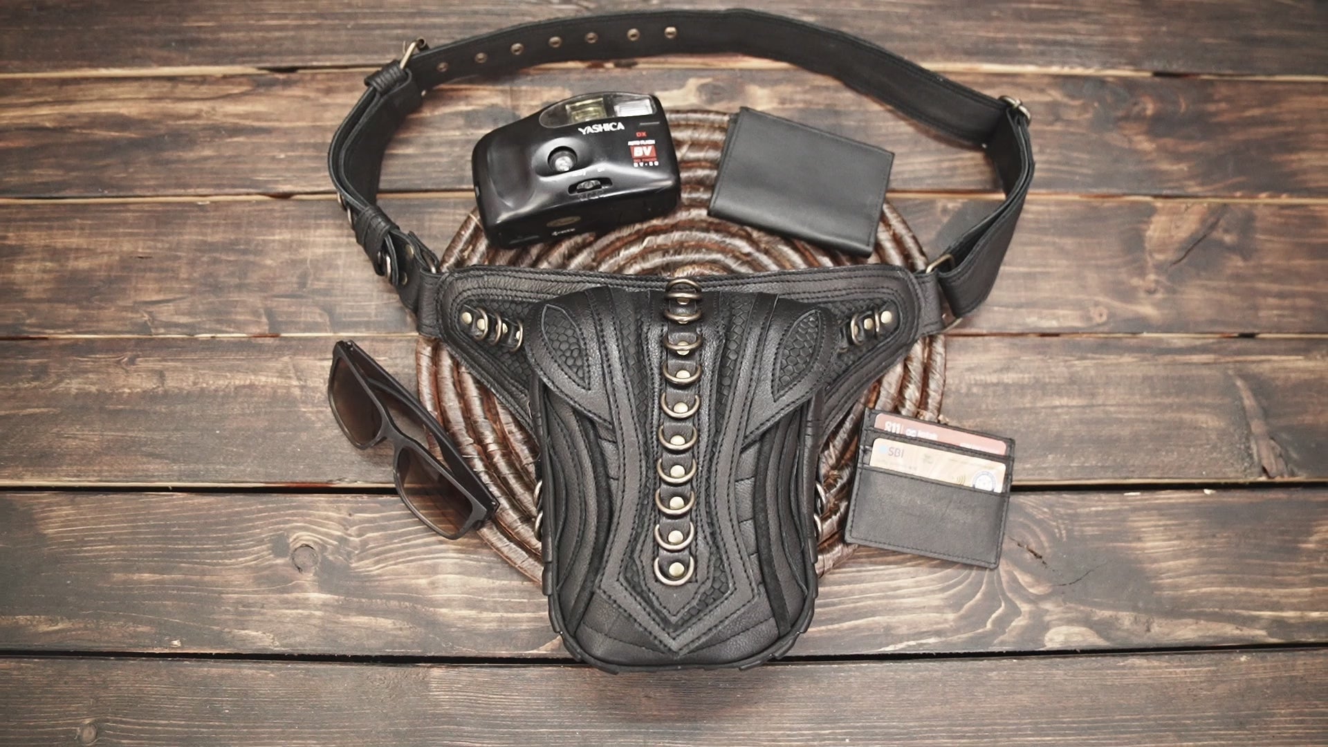 Handcrafted black leather hip belt with metal ring detailing
